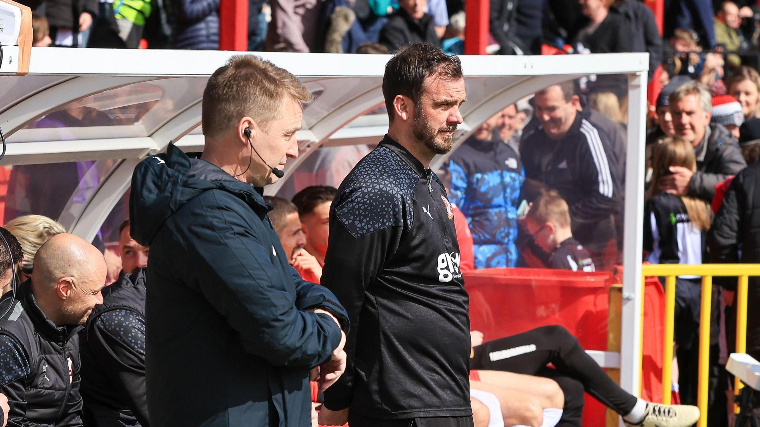 Gavin Gunning (right) on the touchline during a Swindon game