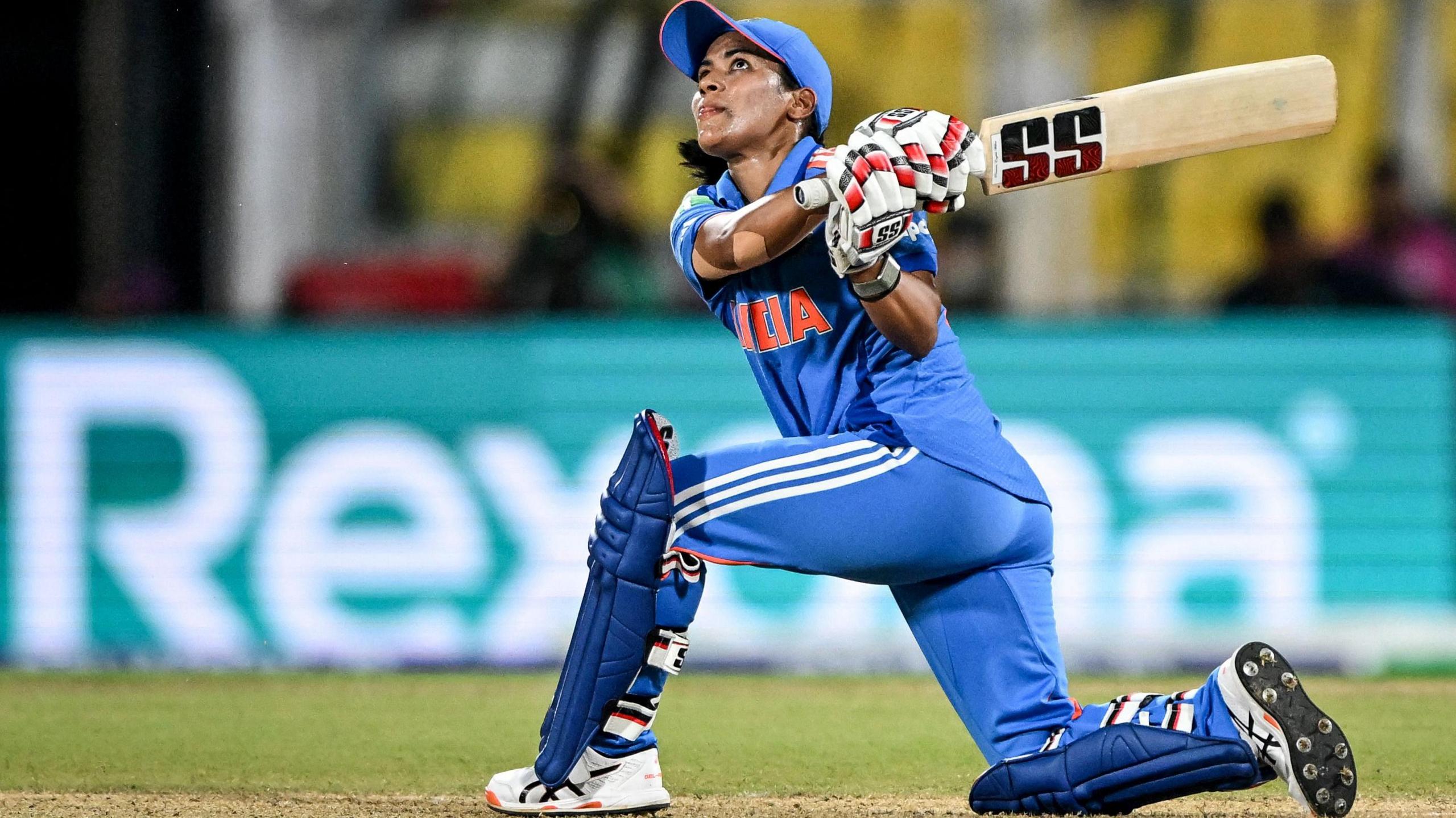 India's Amanjot Kaur watches the ball after playing a shot during the 2025 ICC Women's Cricket World Cup one-day international (ODI) match between India and Sri Lanka at the Barsapara Cricket Stadium in Guwahati on September 30, 2025