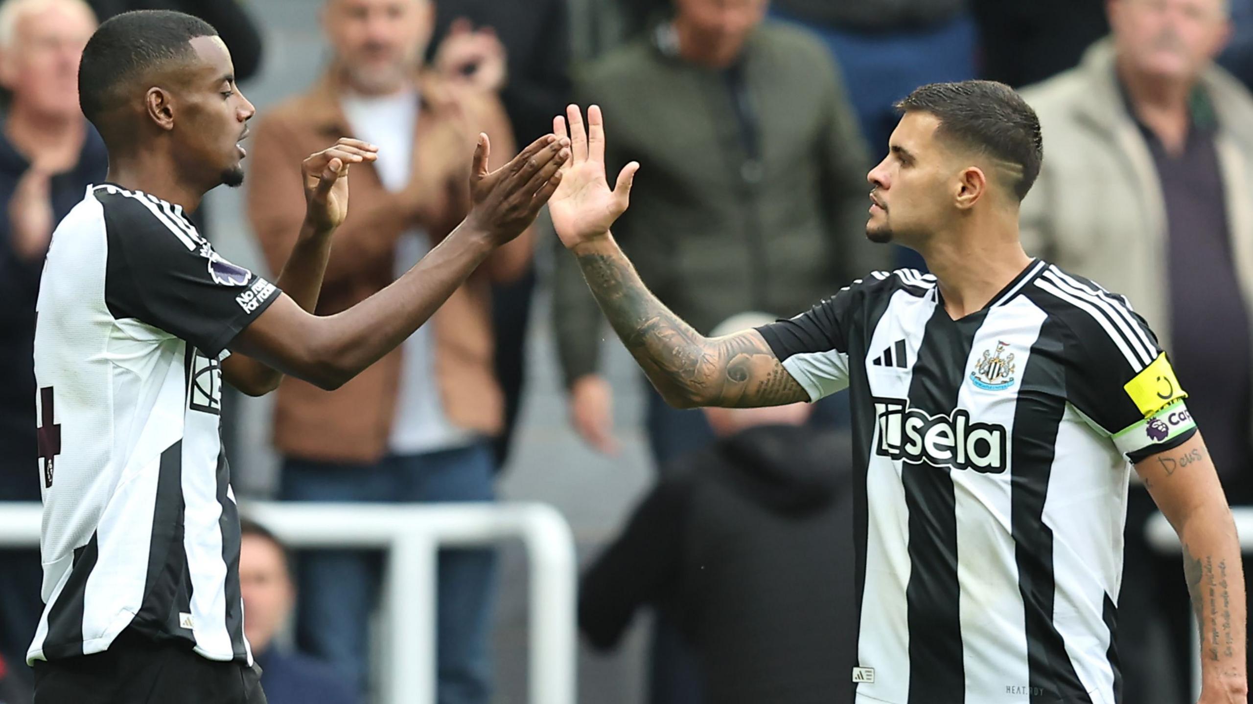 Alexander Isak of Newcastle United celebrates scoring his team's second goal with teammate Bruno Guimaraes
