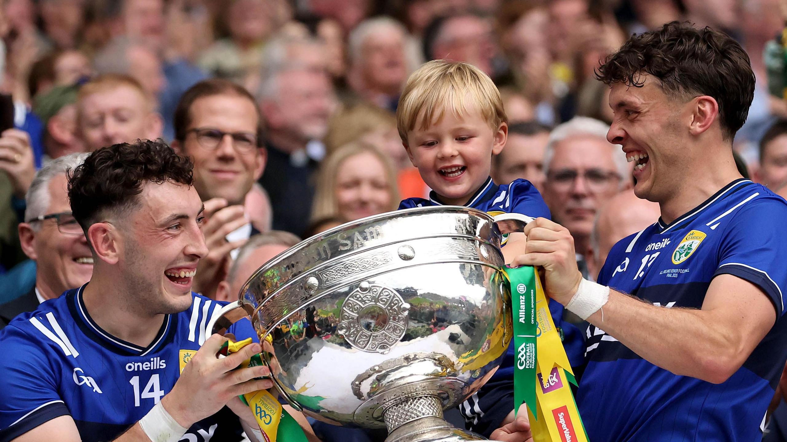 David, Paudie and Ogie Clifford celebrate with the Sam Maguire Cup 