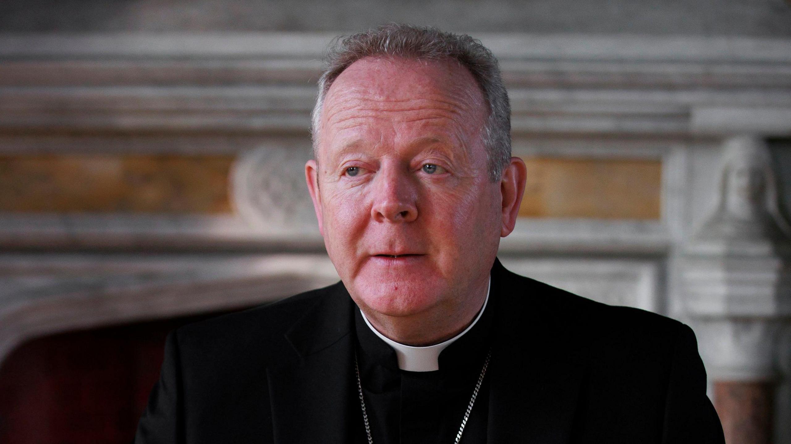 Archbishop Eamon Martin, with short grey hair, dressed in black and pictured from the shoulders up.