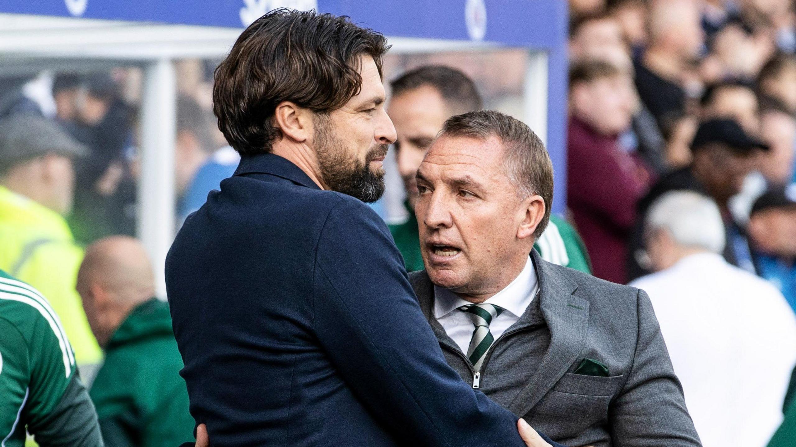 Russell Martin and Brendan Rodgers embrace