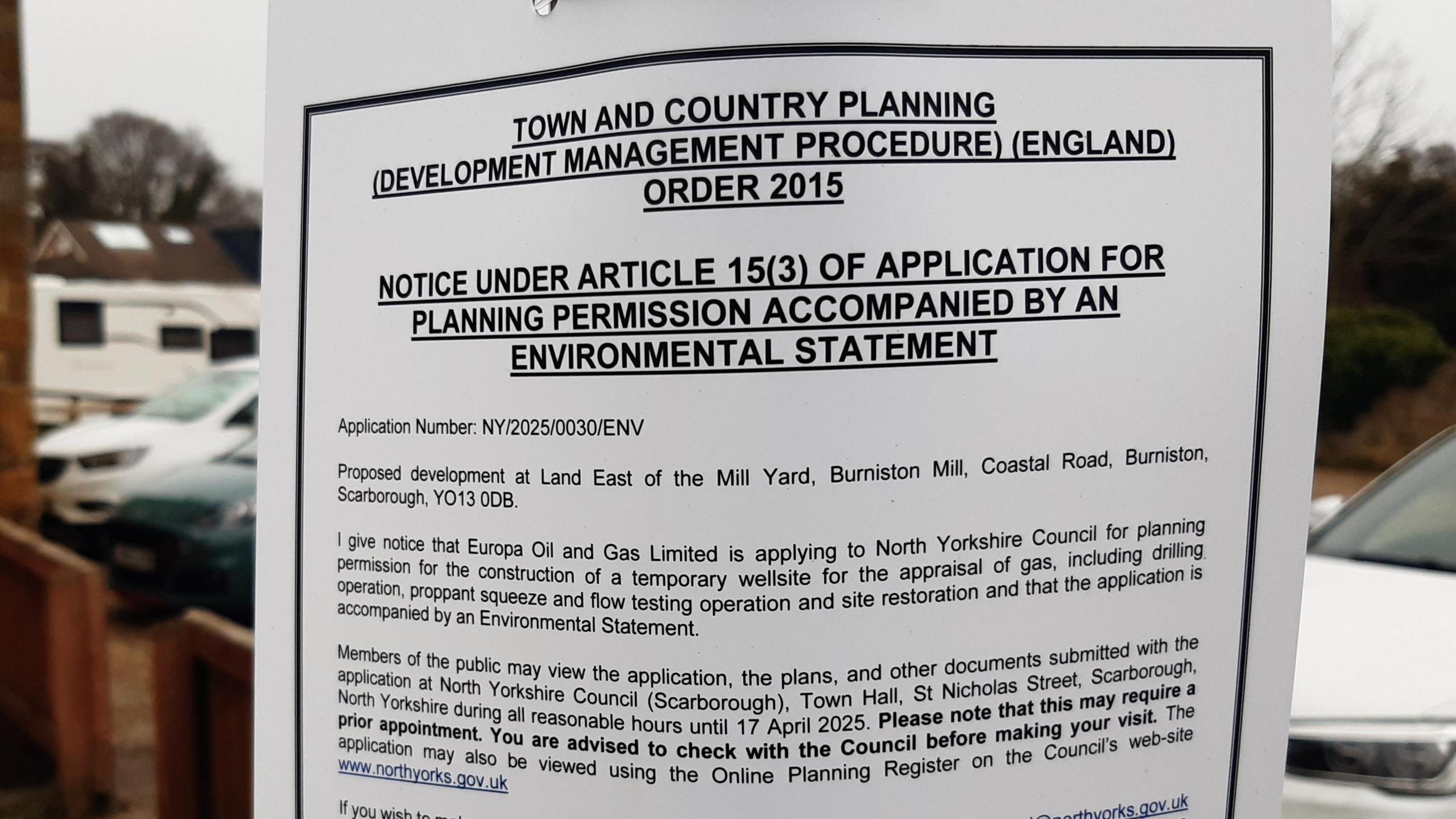 Photo of a sign, reading: "Town and country planning (development management procedure) (England) order 2015. Notice under article 15(3) of application for planning permission accompanied by an environmental statement. Application Number: NY/2025/0030/ENV."
The letter goes on to give notice of the plans described in the article and invites locals to give feedback.