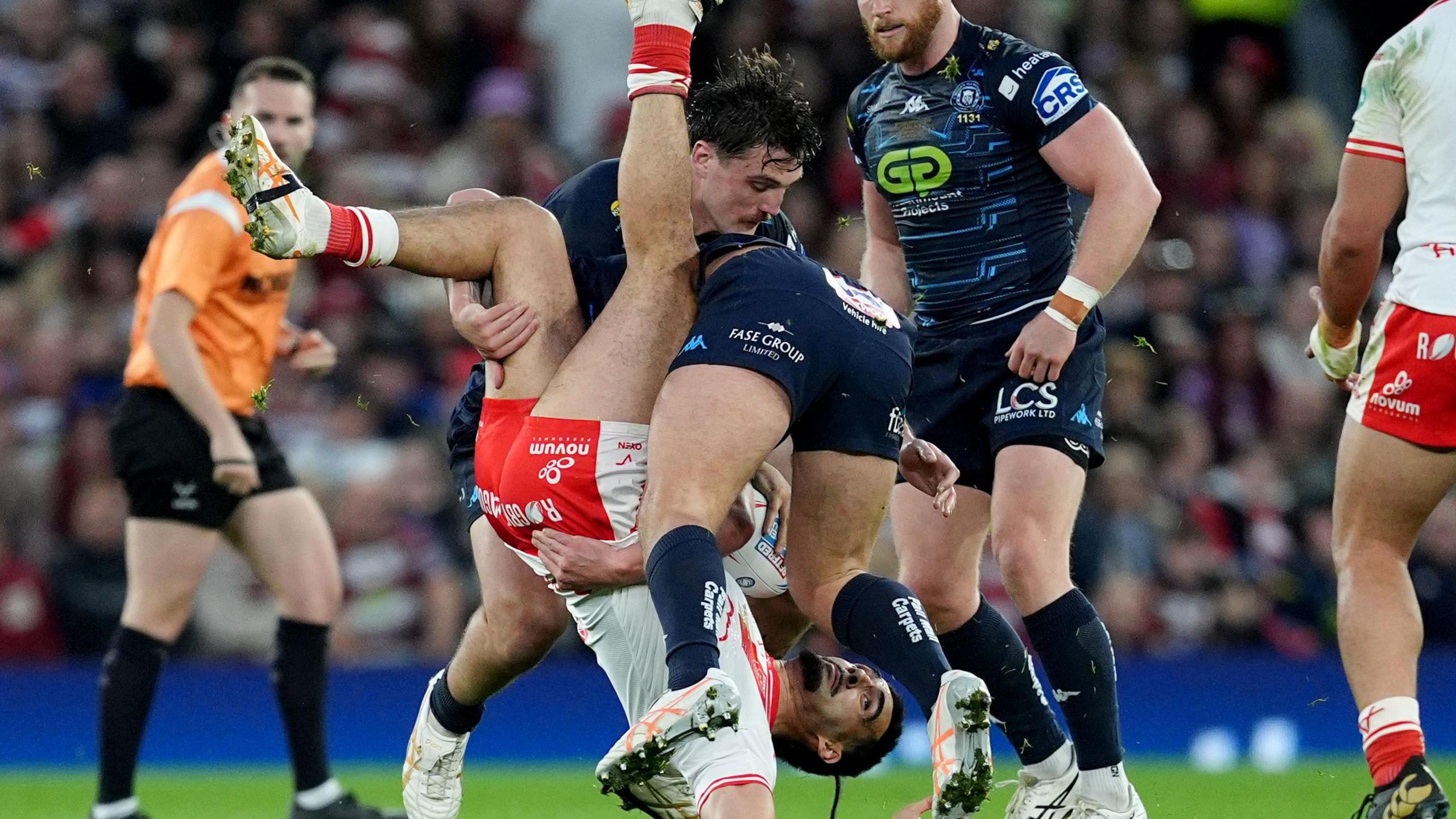 Brad O'Neill tip tackles Tyrone May during the 2025 Super League Grand Final
