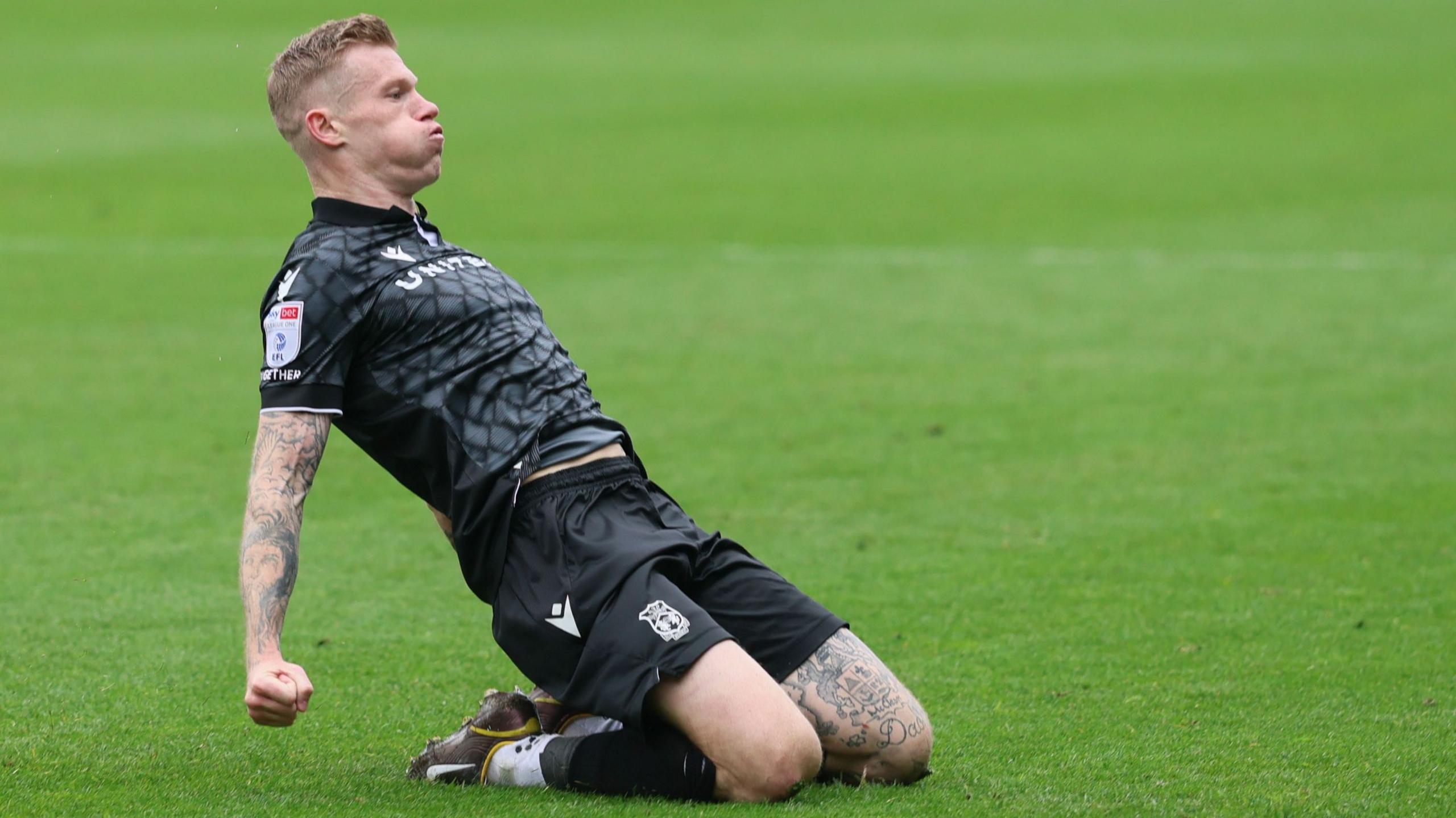 Wrexham wing-back James McClean celebrates
