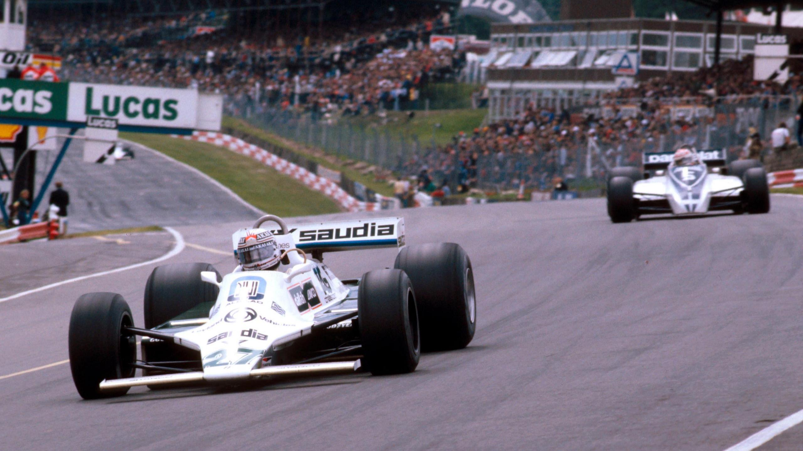 Alan Jones in the Williams FW07B with Brabham's Nelson Piquet behind during the 1980 British Grand Prix at Brands Hatch