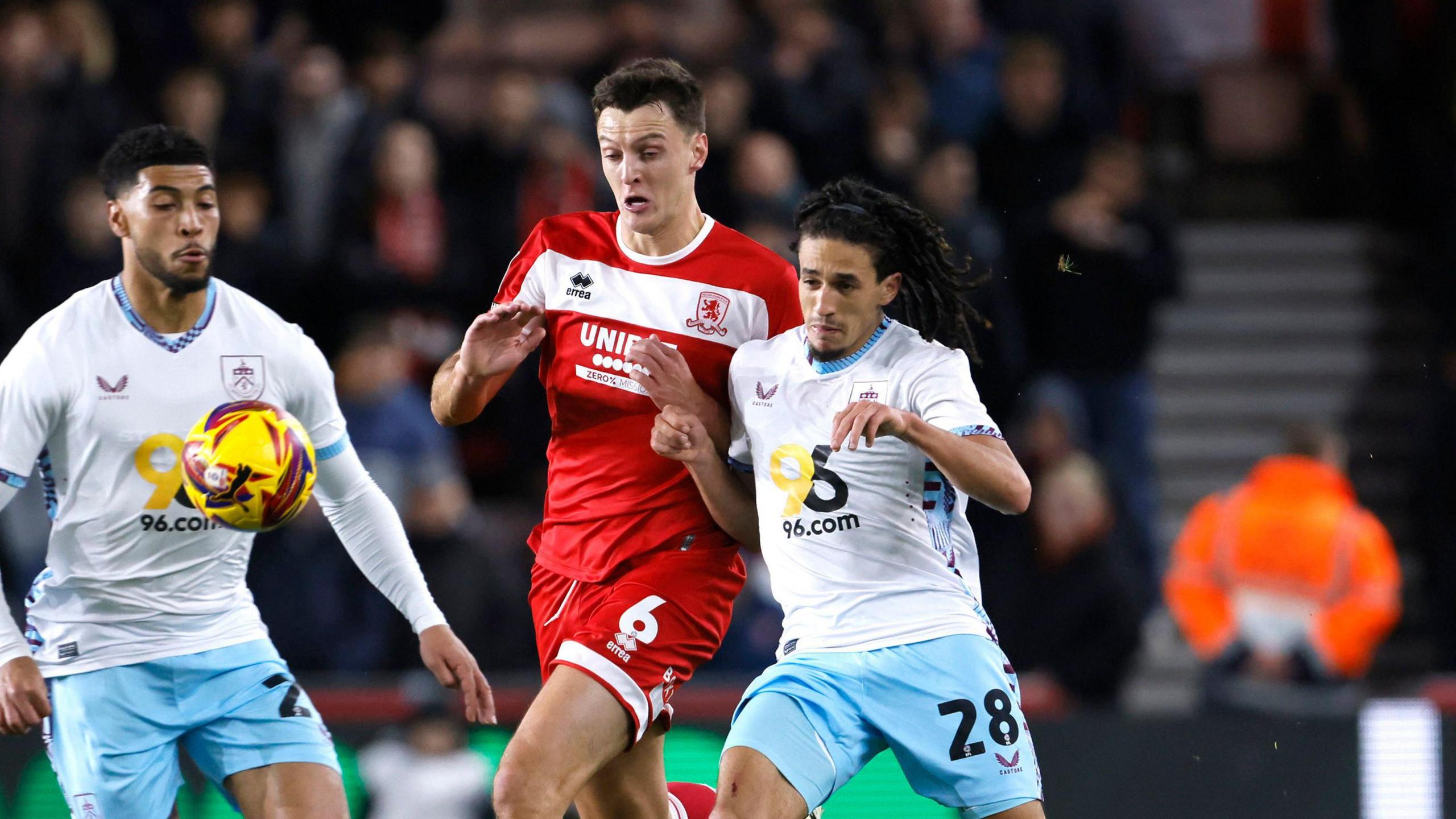 Middlesbrough defender Dael Fry competing for the ball with Burnley's Hannibal Mejbri