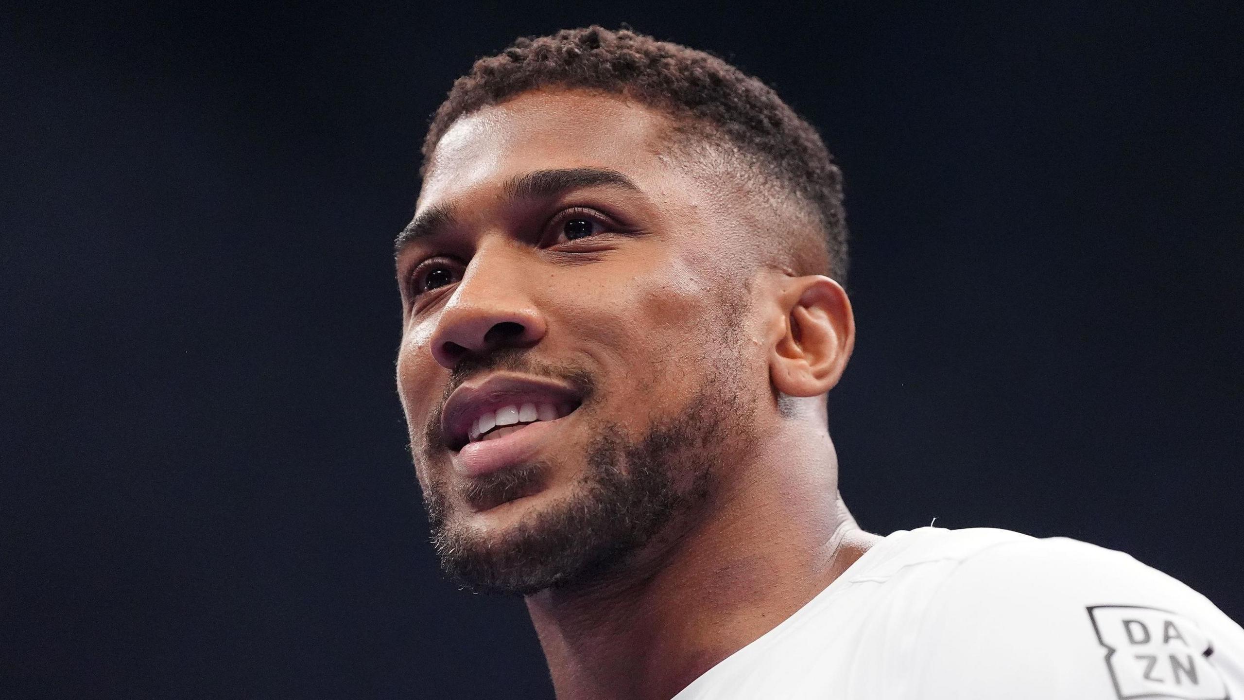 Anthony Joshua smiles