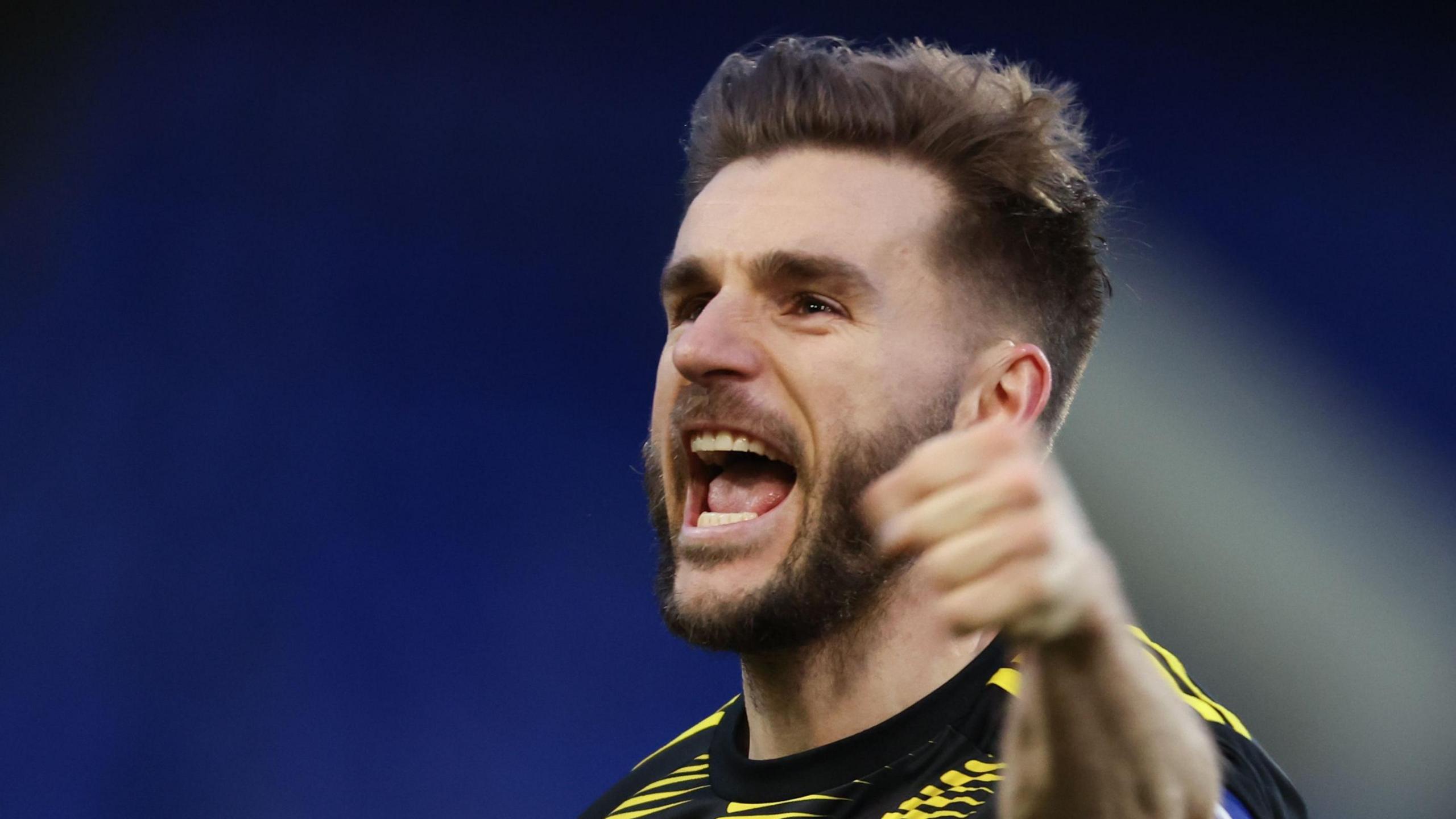 Luke Garbutt celebrates after the final whistle at Tranmere