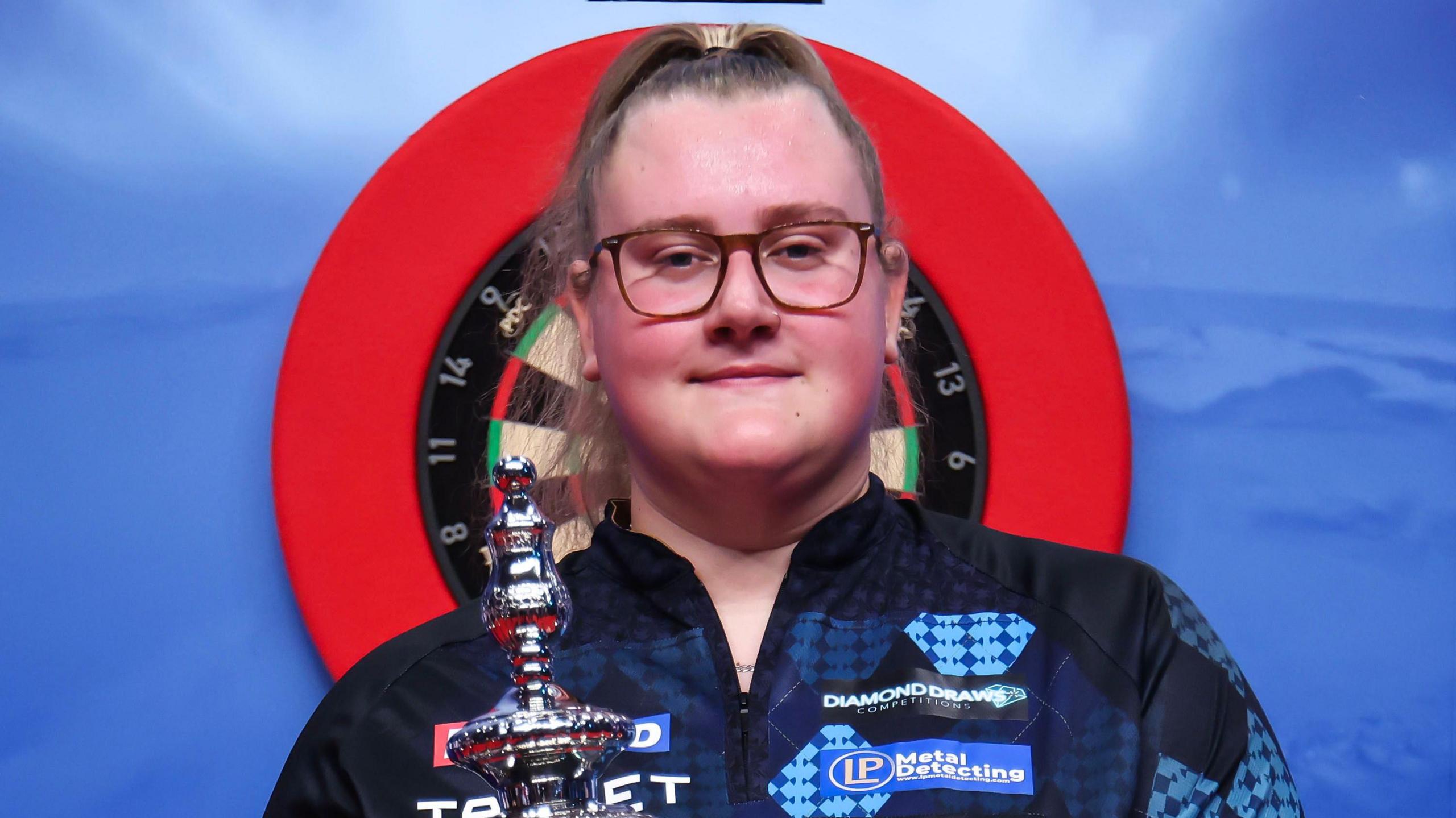 Beau Greaves with Women's World Matchplay trophy after her victory in 2026