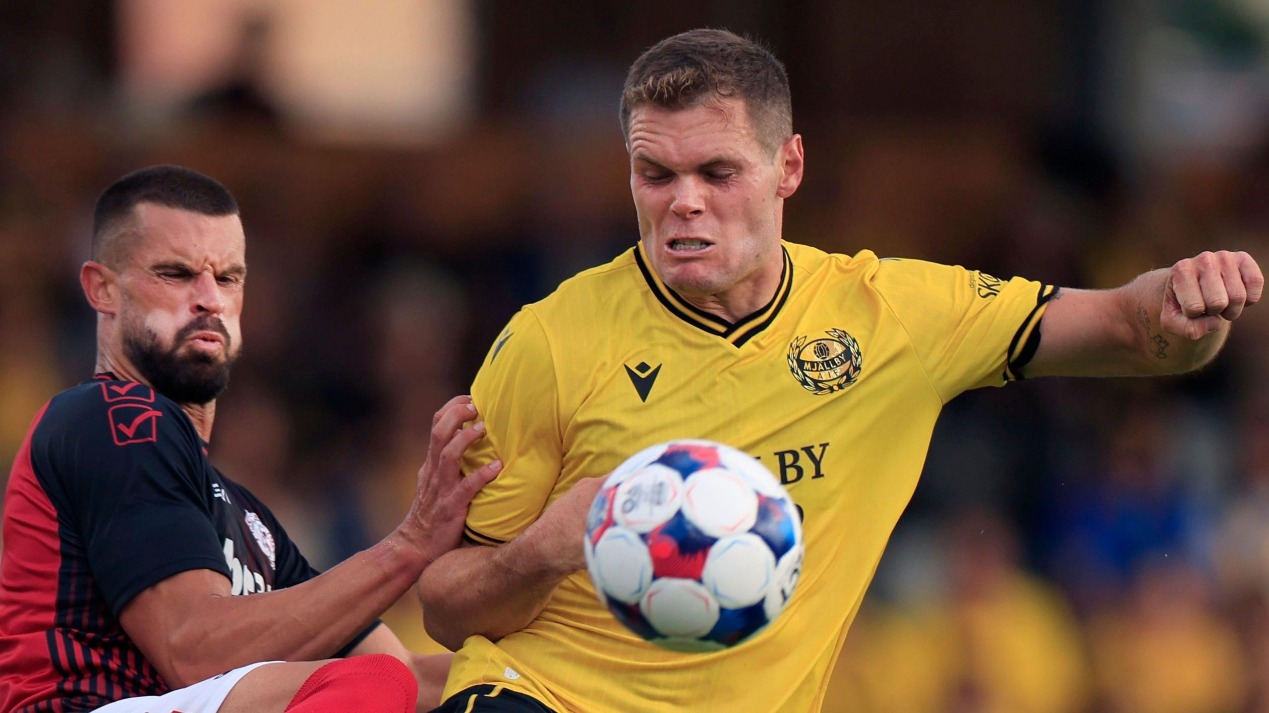Jacob Bergstrom (right) battles for the ball