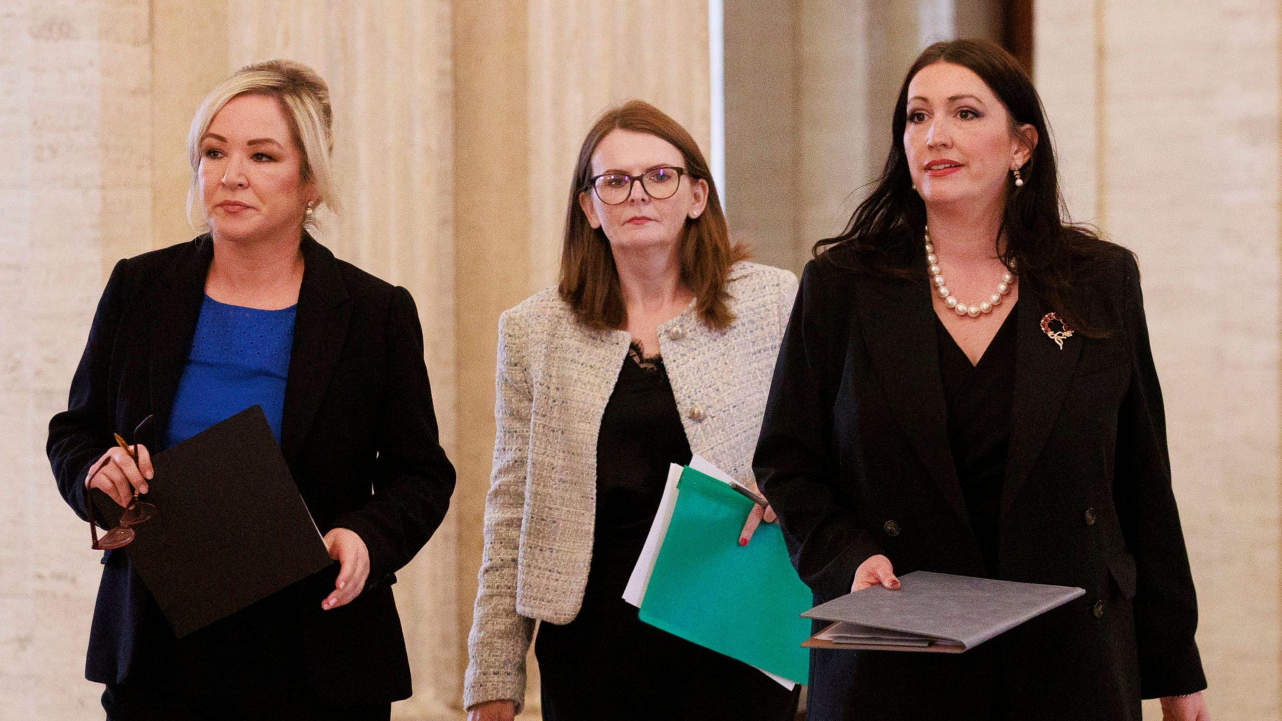 First Minister Michelle O'Neill, Finance Minister Caoimhe Archibald and Deputy First Minister Emma Little-Pengelly