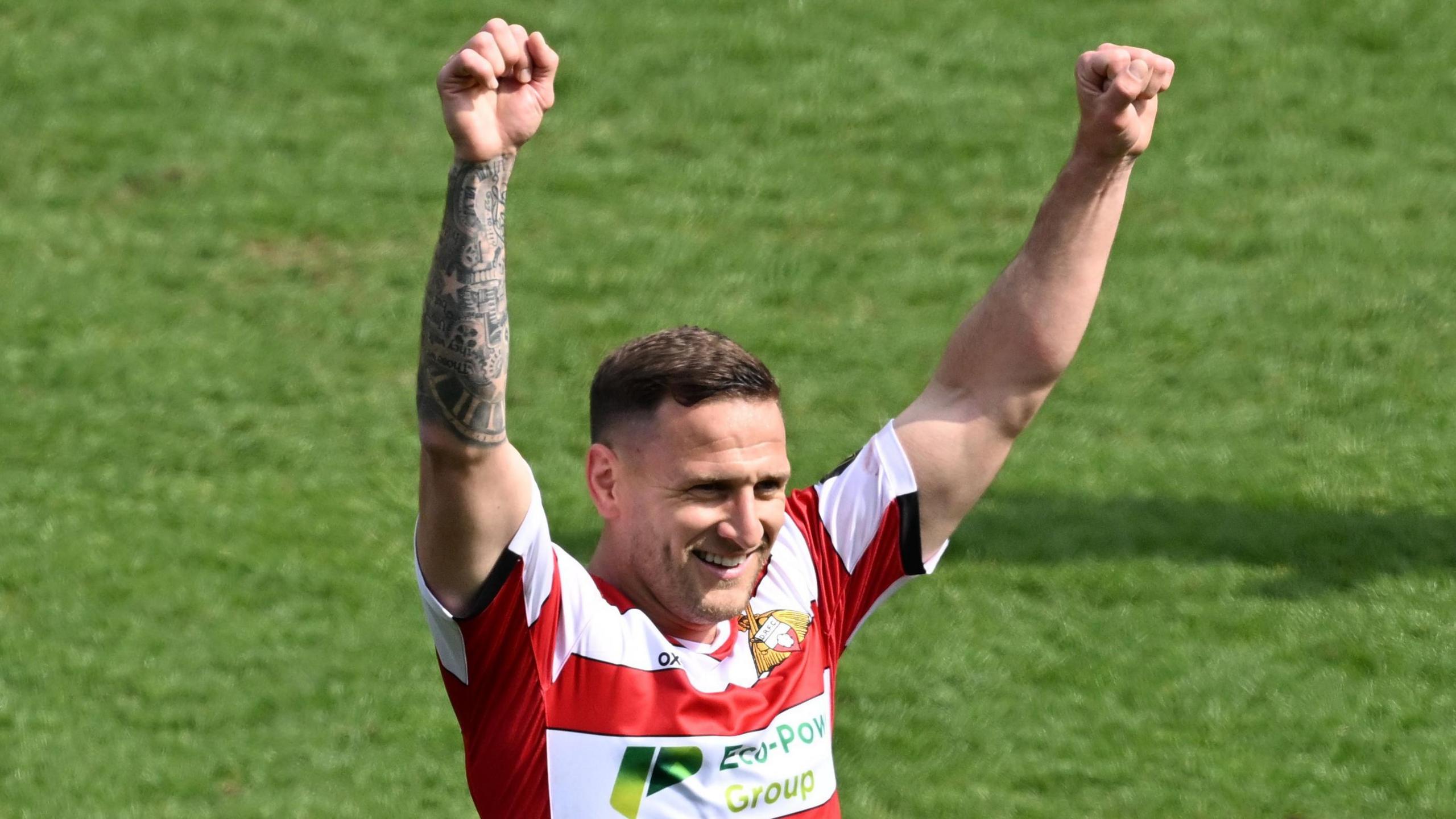 Billy Sharp raises both fists following Doncaster's win