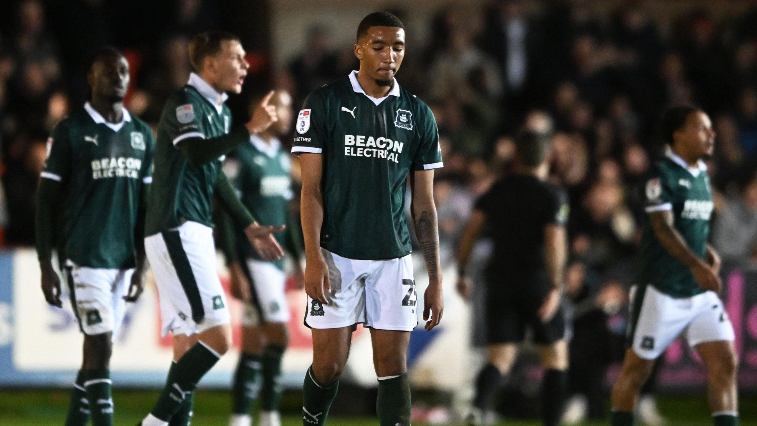 Plymouth Argyle's players cut dejected figures at St James Park on Thursday night