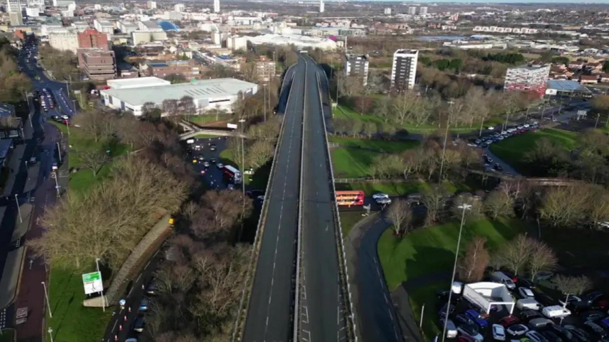 An aerial view of Gateshead flyover. It is a long road bridge with two lanes travelling northbound towards Newcastle and two lanes travelling southbound into Gateshead.