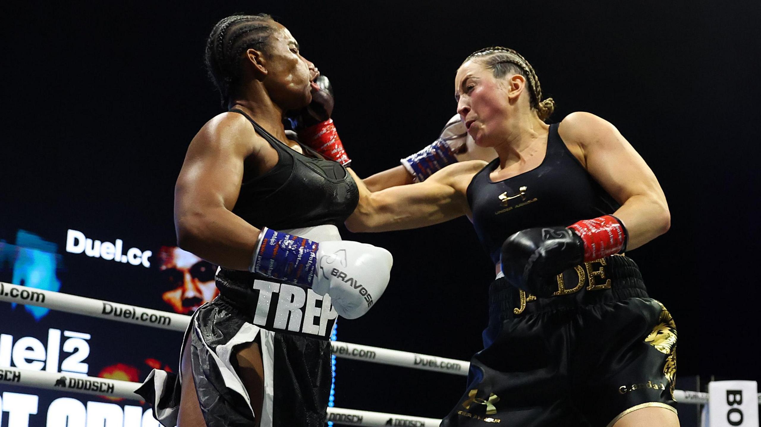 Jade Jones (right) lands a punch on US reality TV star Egypt Criss