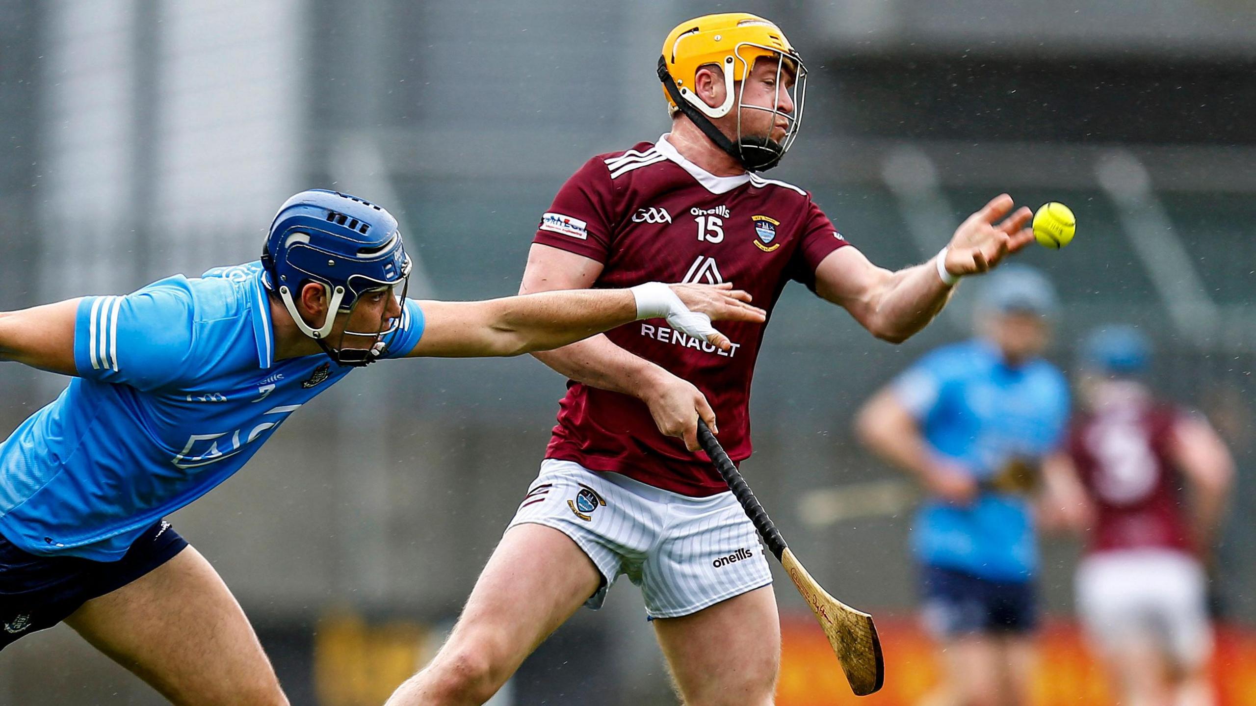 Westmeath’s Davy Glennon makes a handpass under pressure from Dublin's Eoghan O'Donnell during a Leinster SHC game in 2022