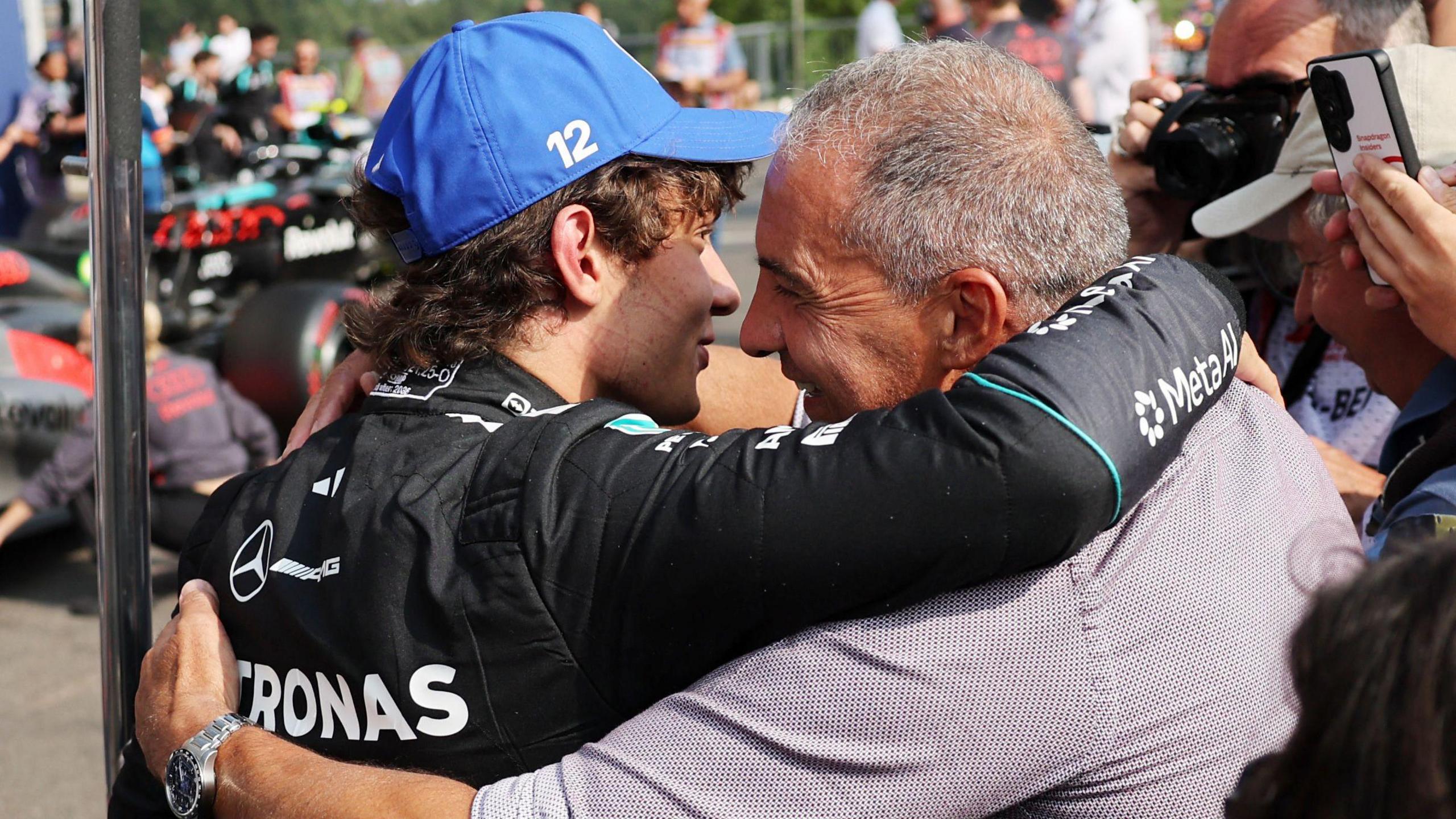 Kimi Antonelli and his dad Marco embrace after qualifying