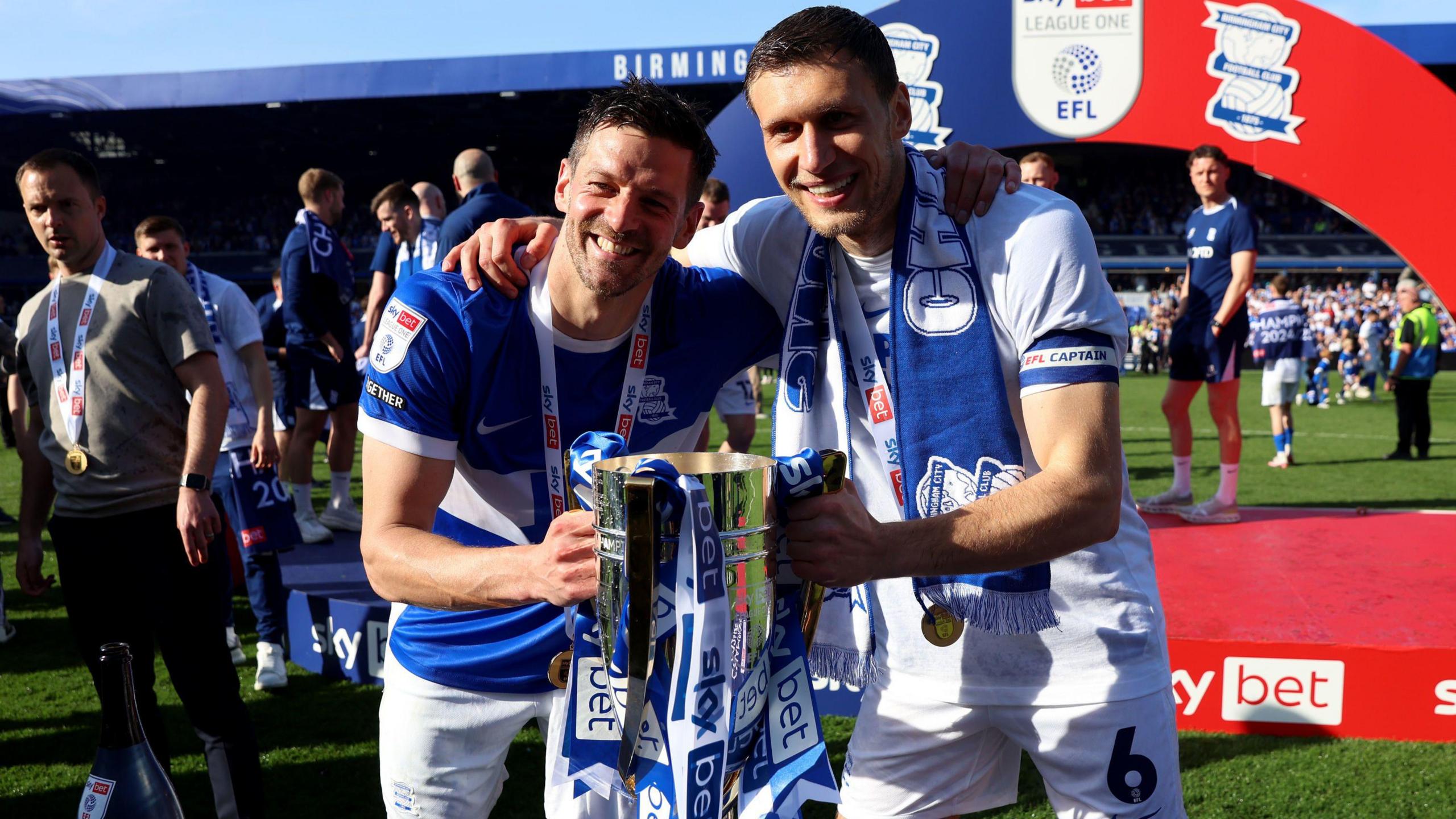 Lukas Jutkiewicz poses with the League One champions trophy after the final game of the season