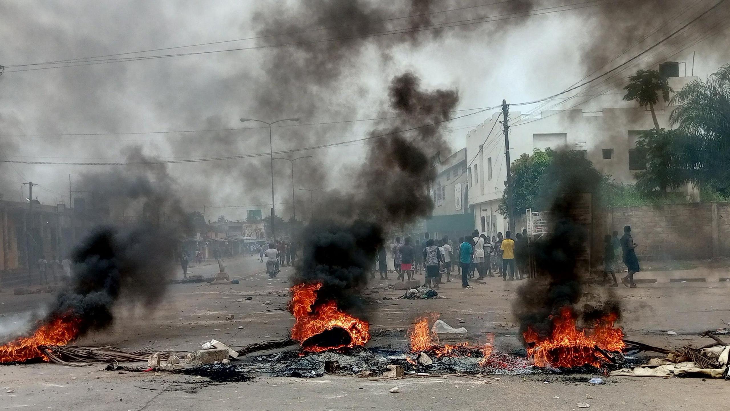 Makeshift barricades burn as people protest against Togo's longtime leader, Faure Gnassingbe, in Lomé, Togo.