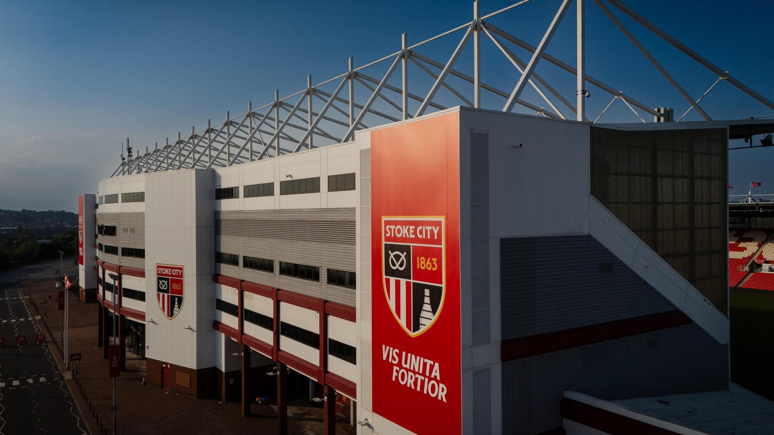A picture of the outside of Stoke's home ground the bet365 Stadium showing the new badge in two locations on the wall.