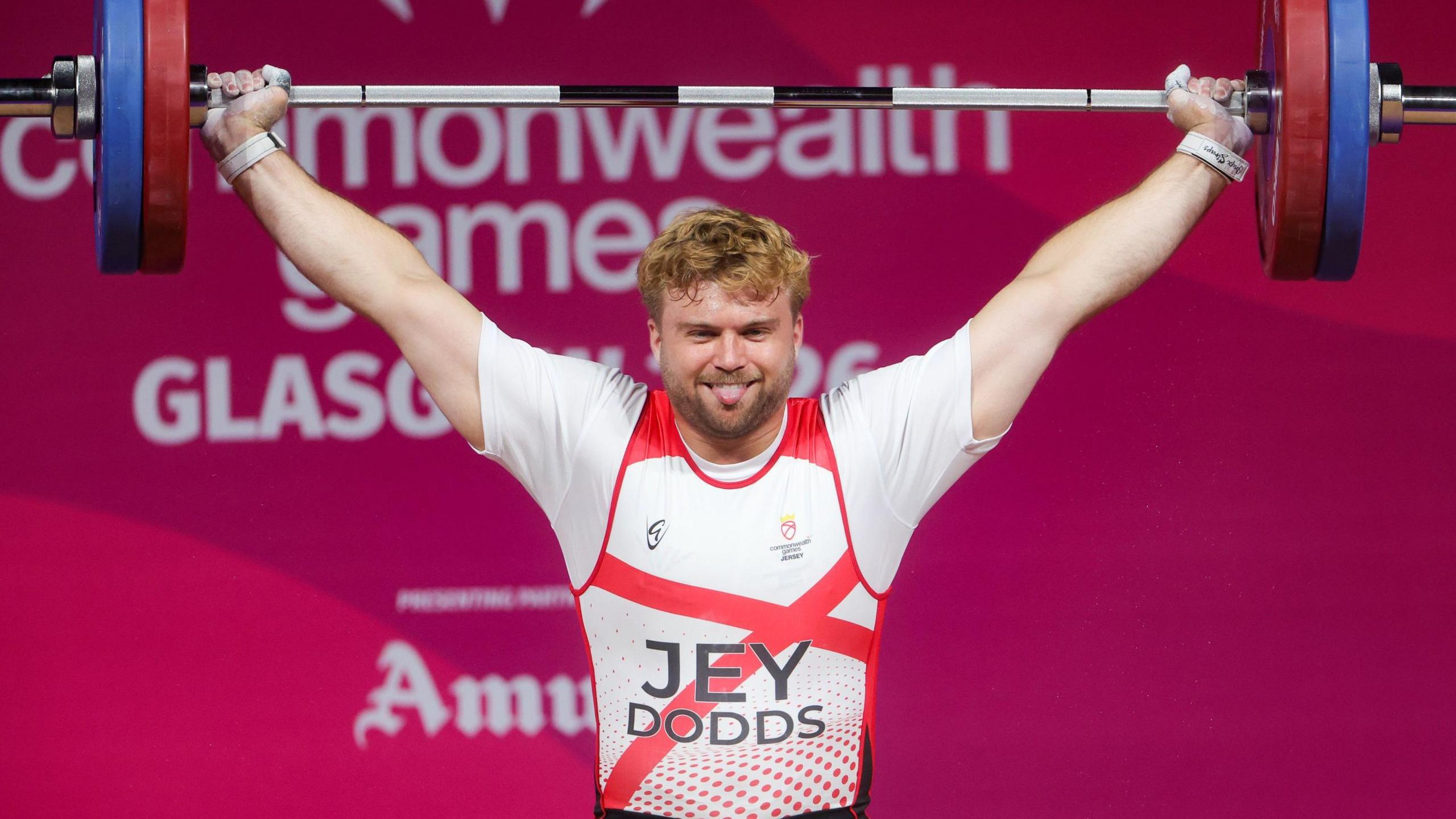 Olly Dodds lifts weights above his head