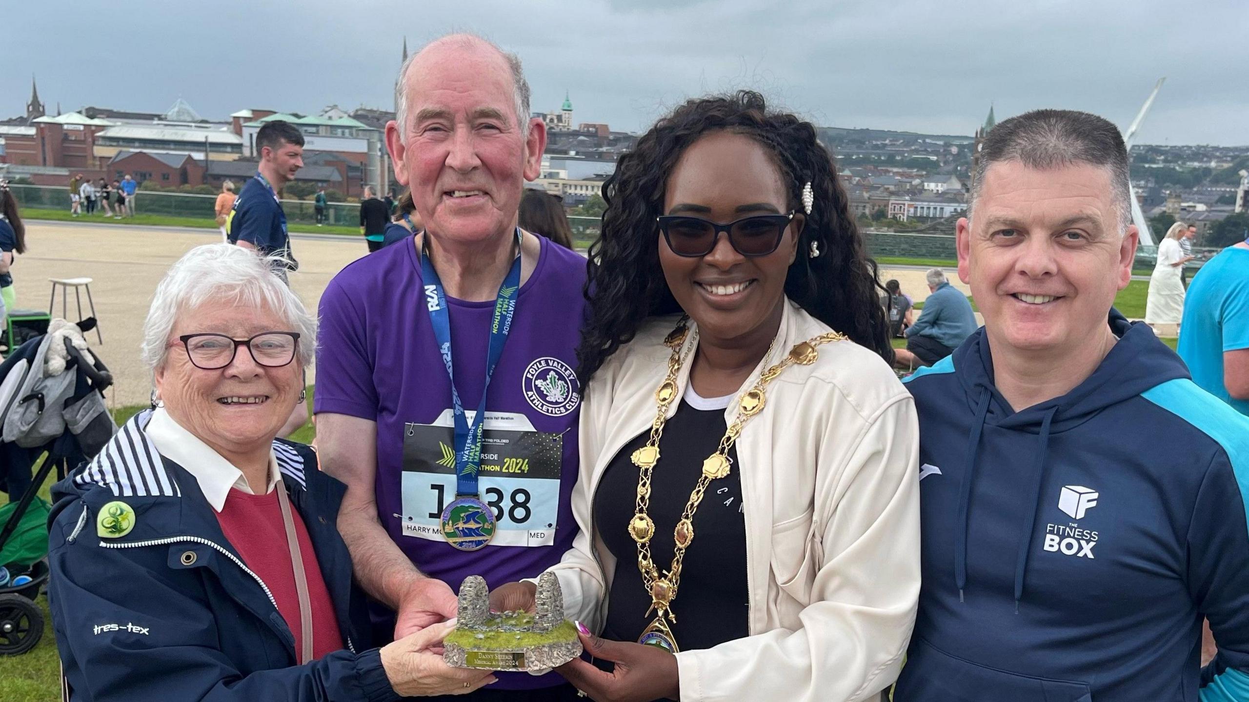 Mayor of Derry City and Strabane District Council with members of the McNulty and Sheerin families and Danny’ Sheerin's wife Rose Sheerin presenting award to Harry McNulty