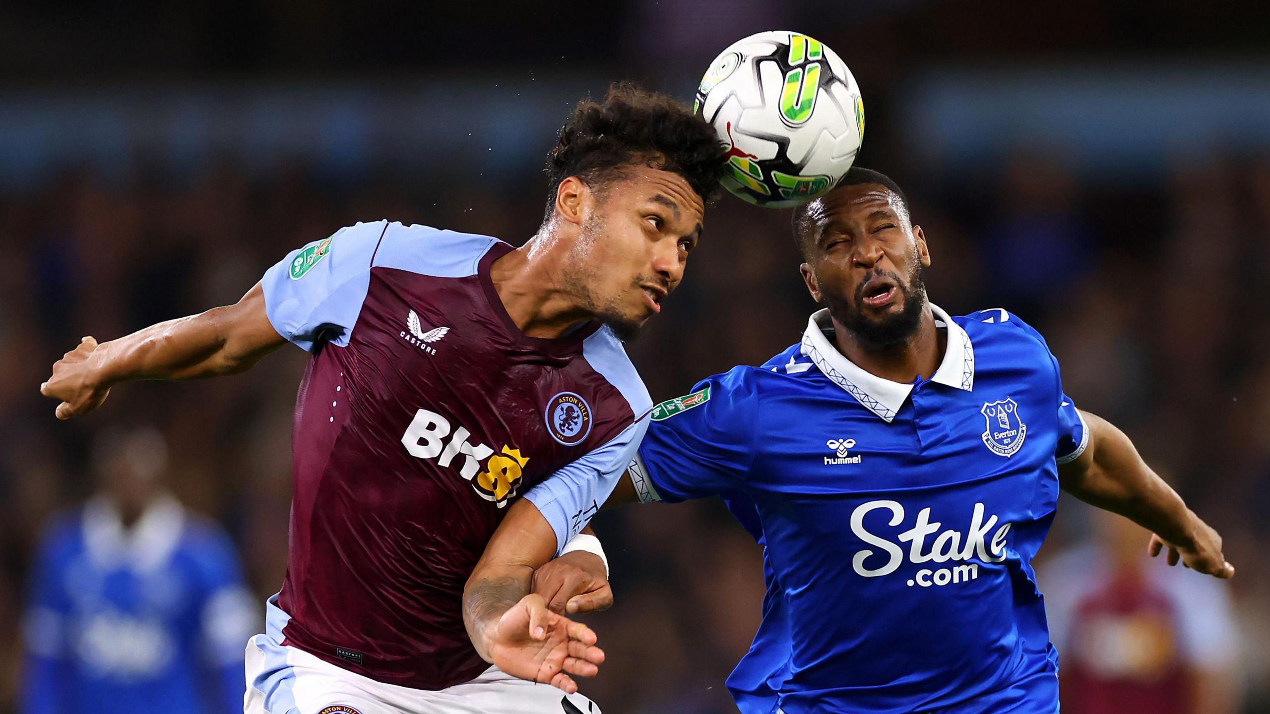 Aston Villa's Boubacar Kamara and Everton's Beto compete for a header