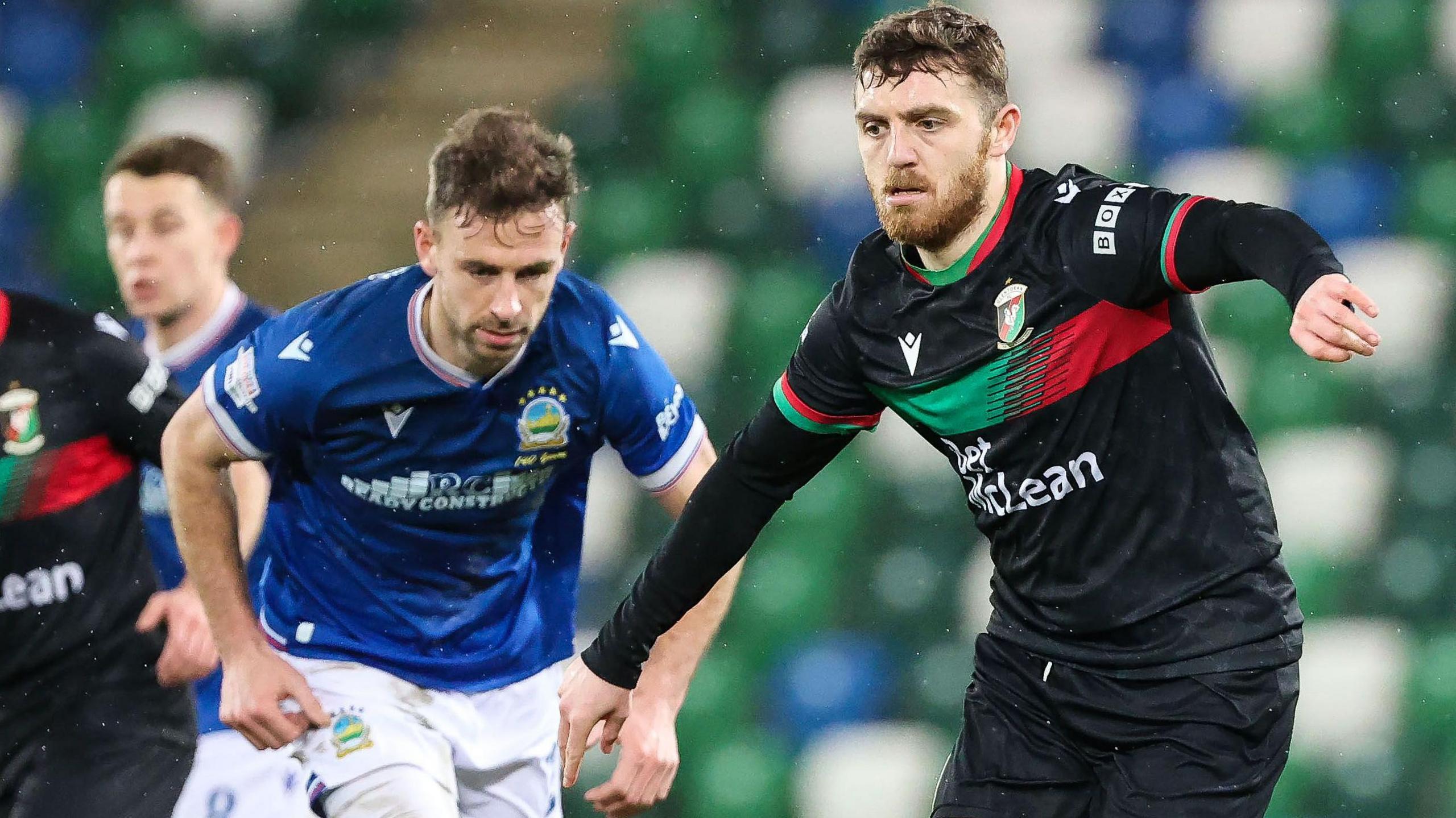 Linfield's Matthew Fitzpatrick and Ryan Cooney of Glentoran