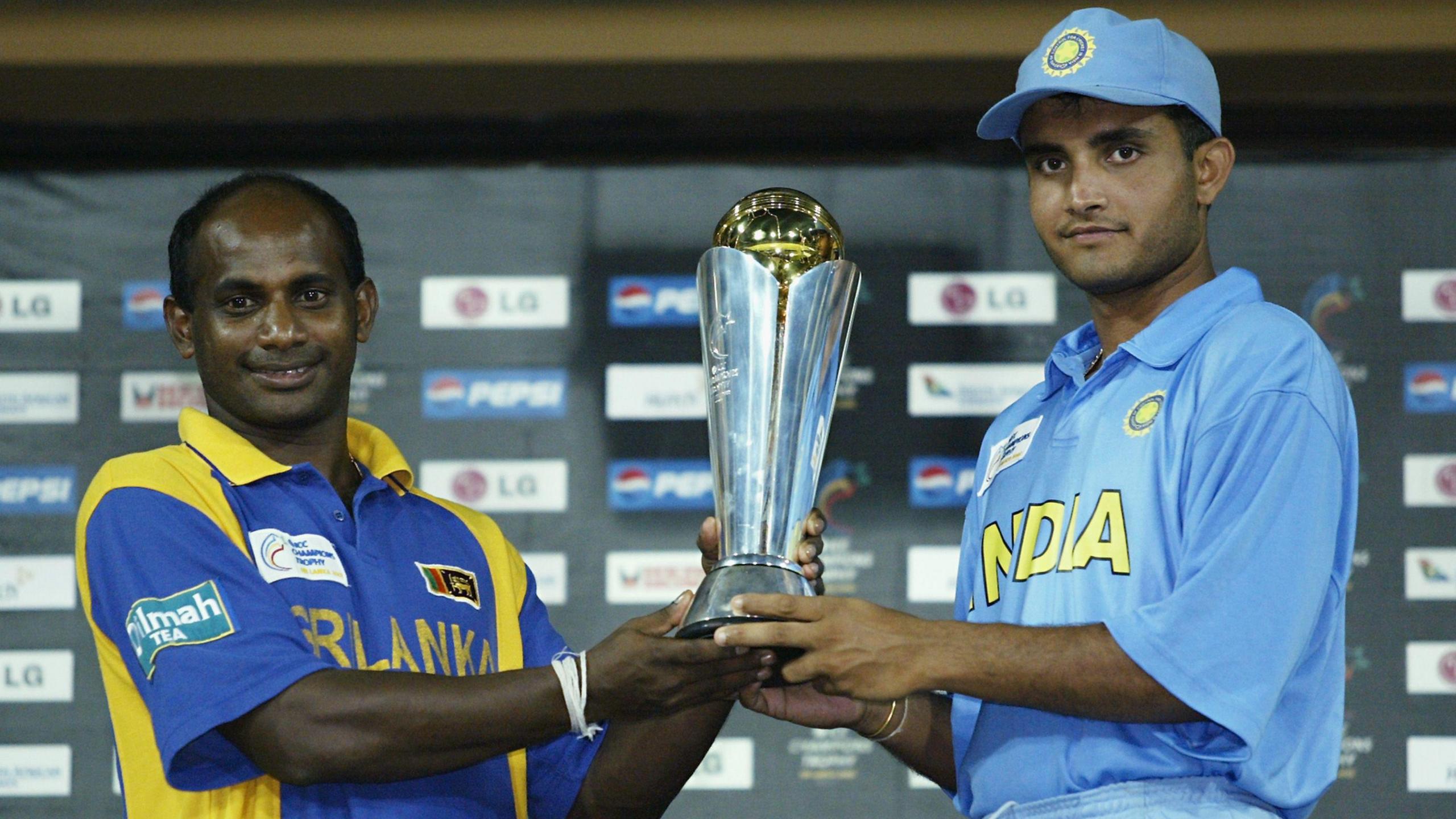 Sanath Jayasuriya of Sri Lanka and Sourav Ganguly of India with the Champions Trophy silverware after their sides share the 2002 tournament 