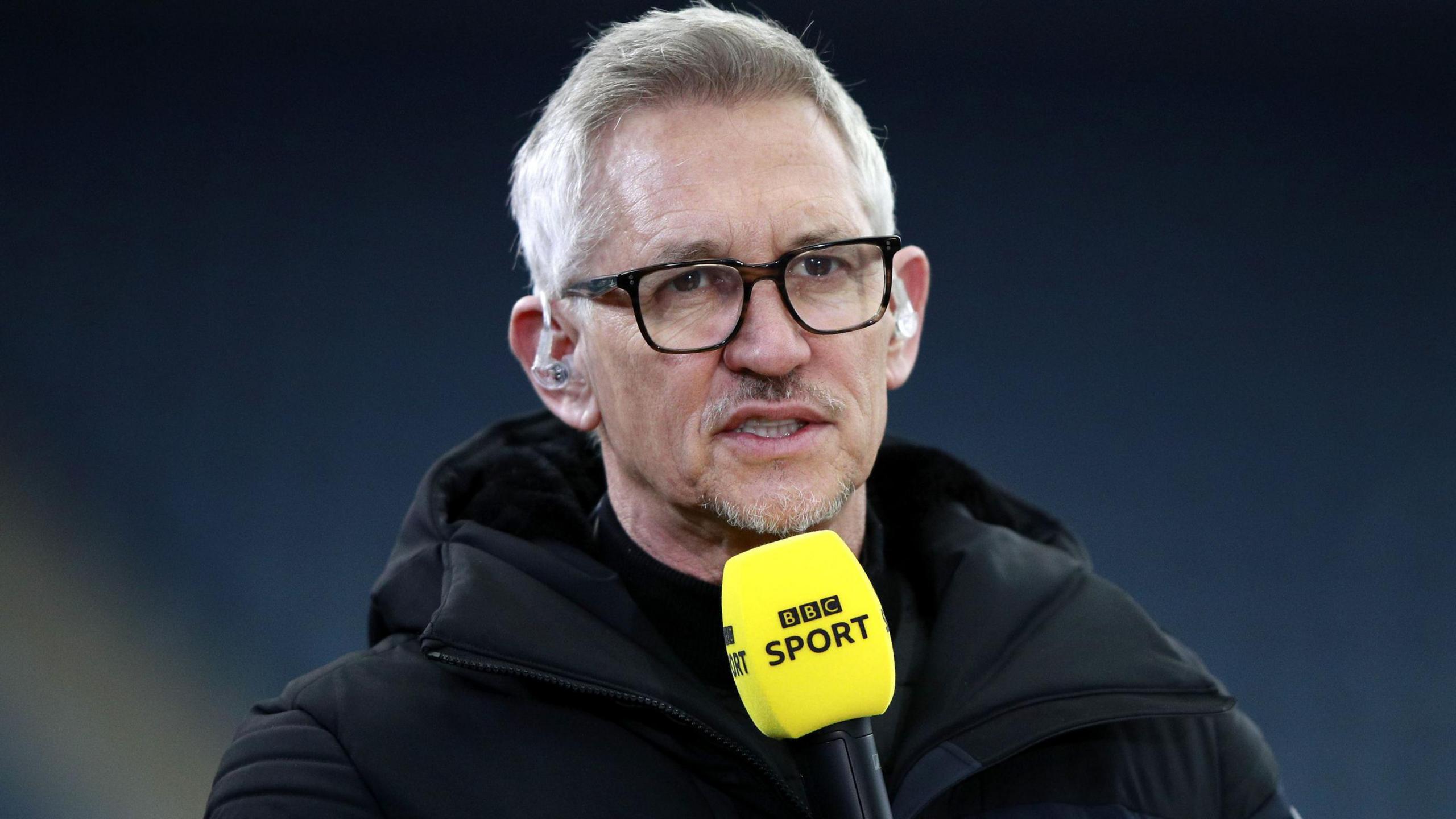 Gary Lineker talking into a BBC Sport mic