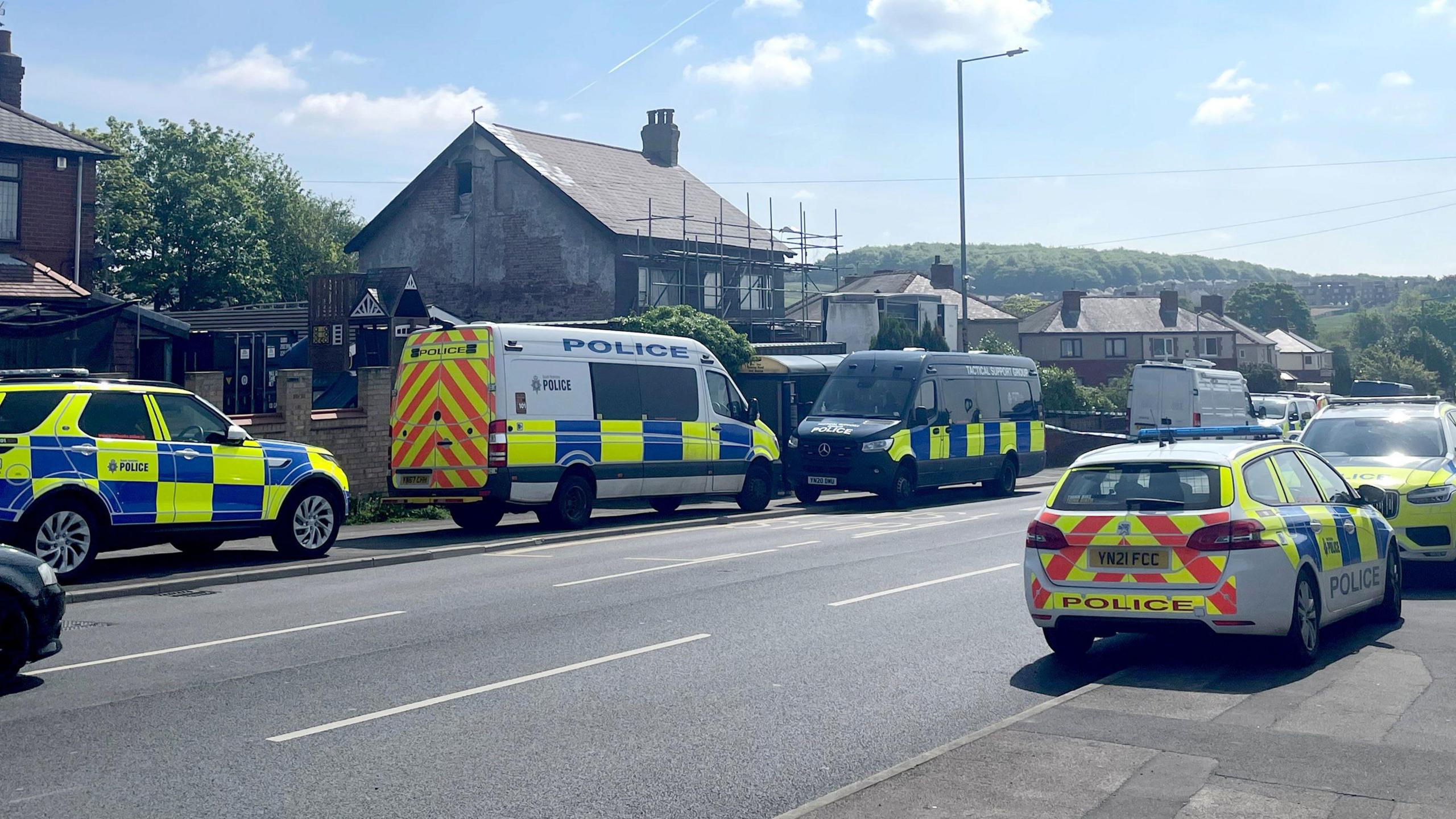 Police cars outside a house