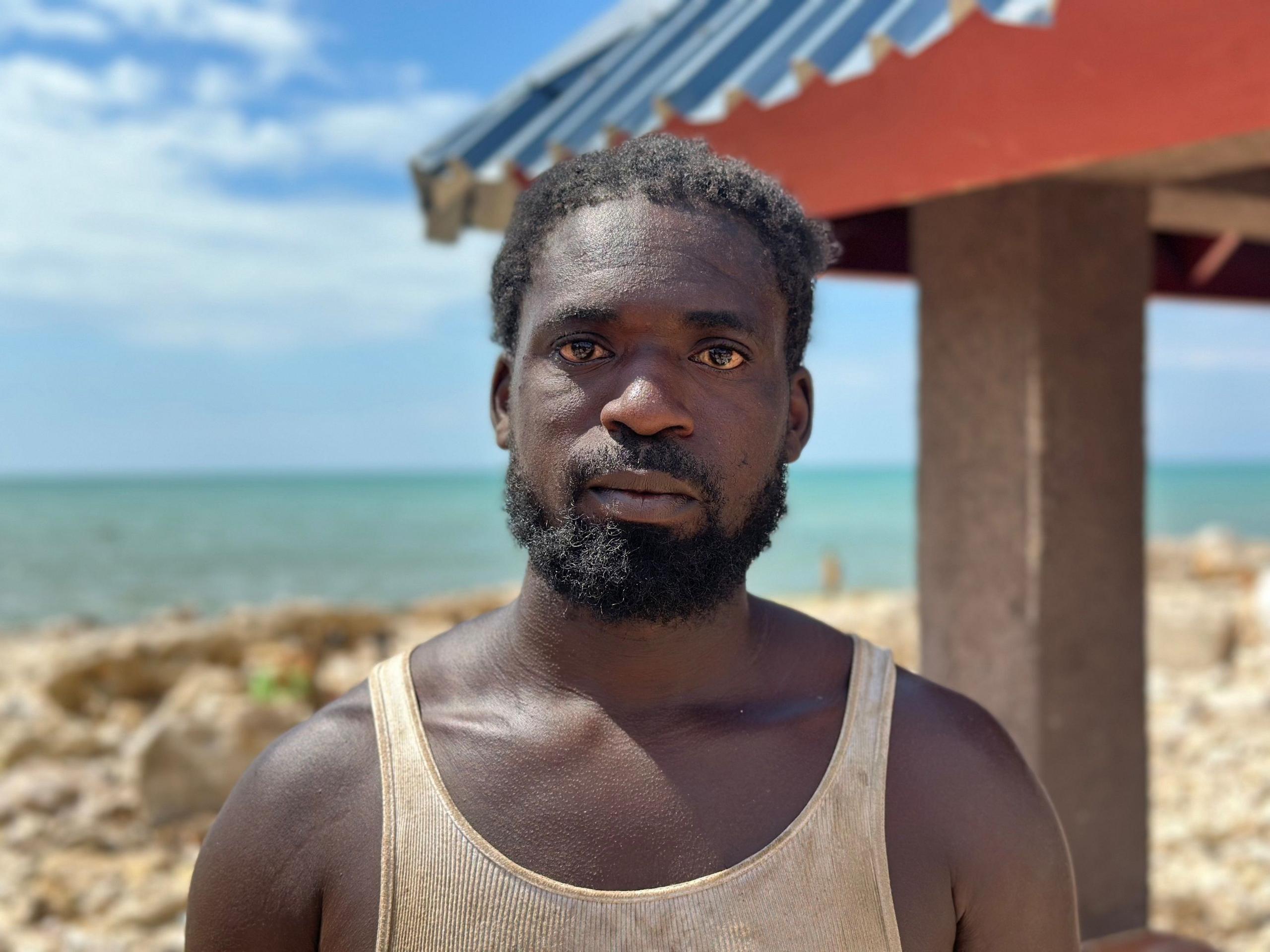 Demar Walker is seen wearing a white tank top