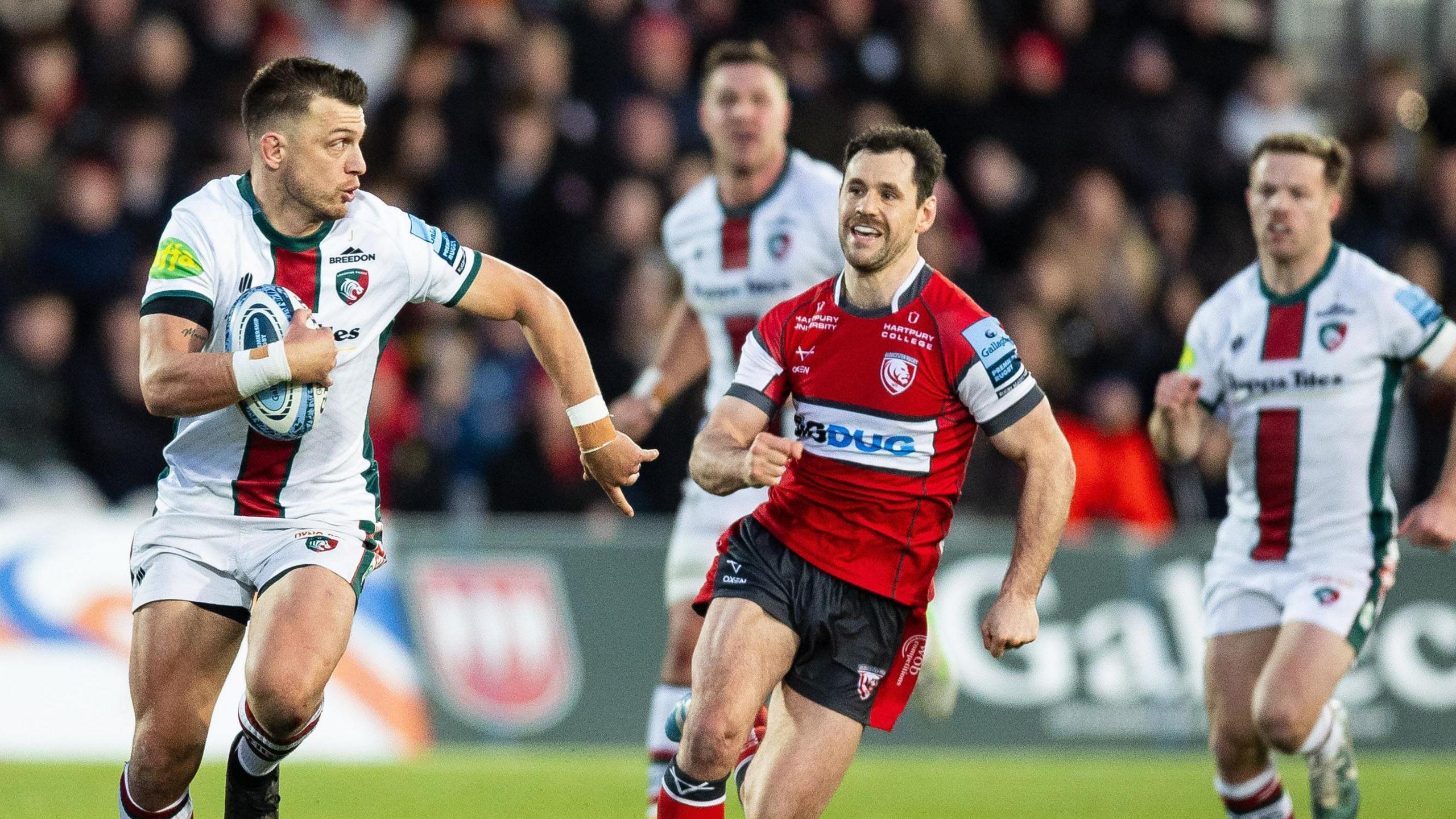 Handre Pollard (left) runs with the ball as Tomos Williams (right) chases