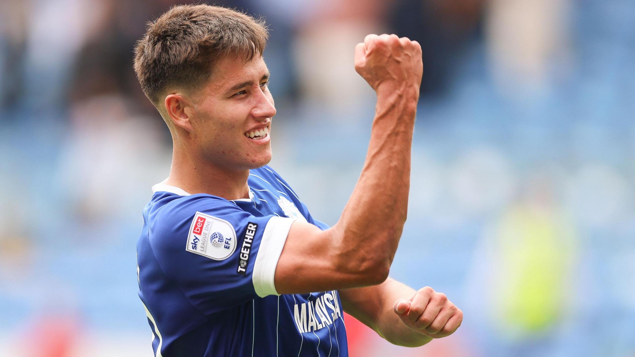 Rubin Colwill raises a clenched fist in celebration