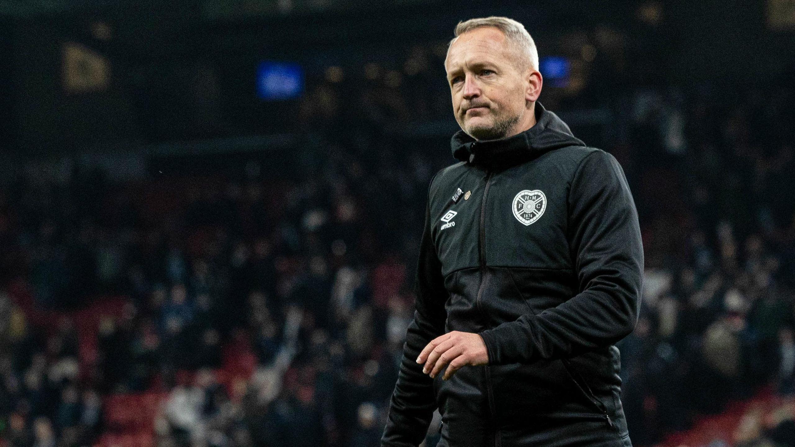 Heart of Midlothian Head Coach Neil Critchley looks dejected at full time during a UEFA Conference League 2024/25 League Phase MD5 match between FC Copenhagen and Heart of Midlothian at Parken Stadium