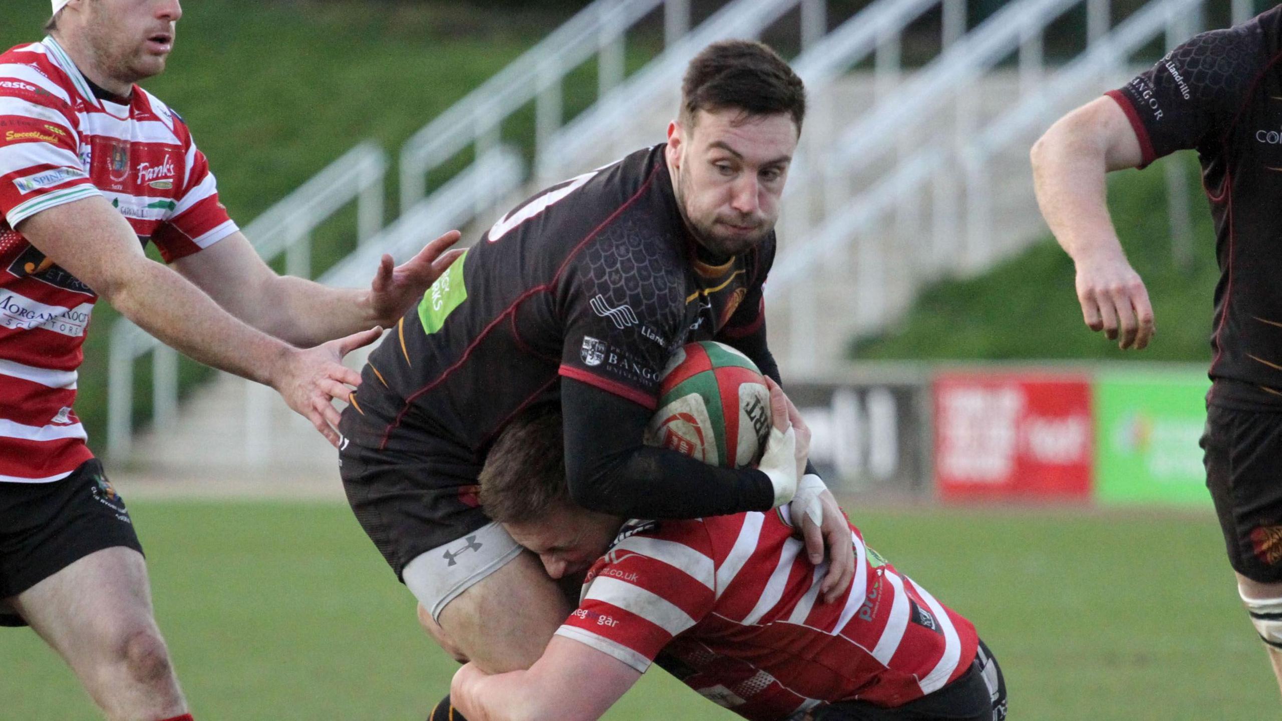 RGC fly-half Billy McBryde is tackled in the Super Rygbi Cymru game against Llandovery