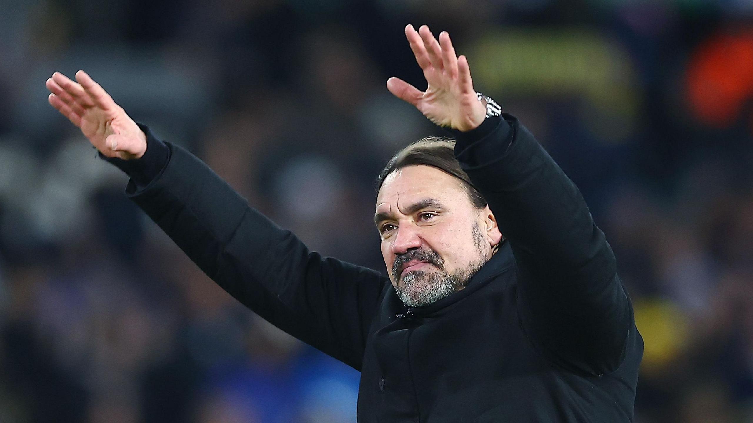 Daniel Farke with his hands in the air