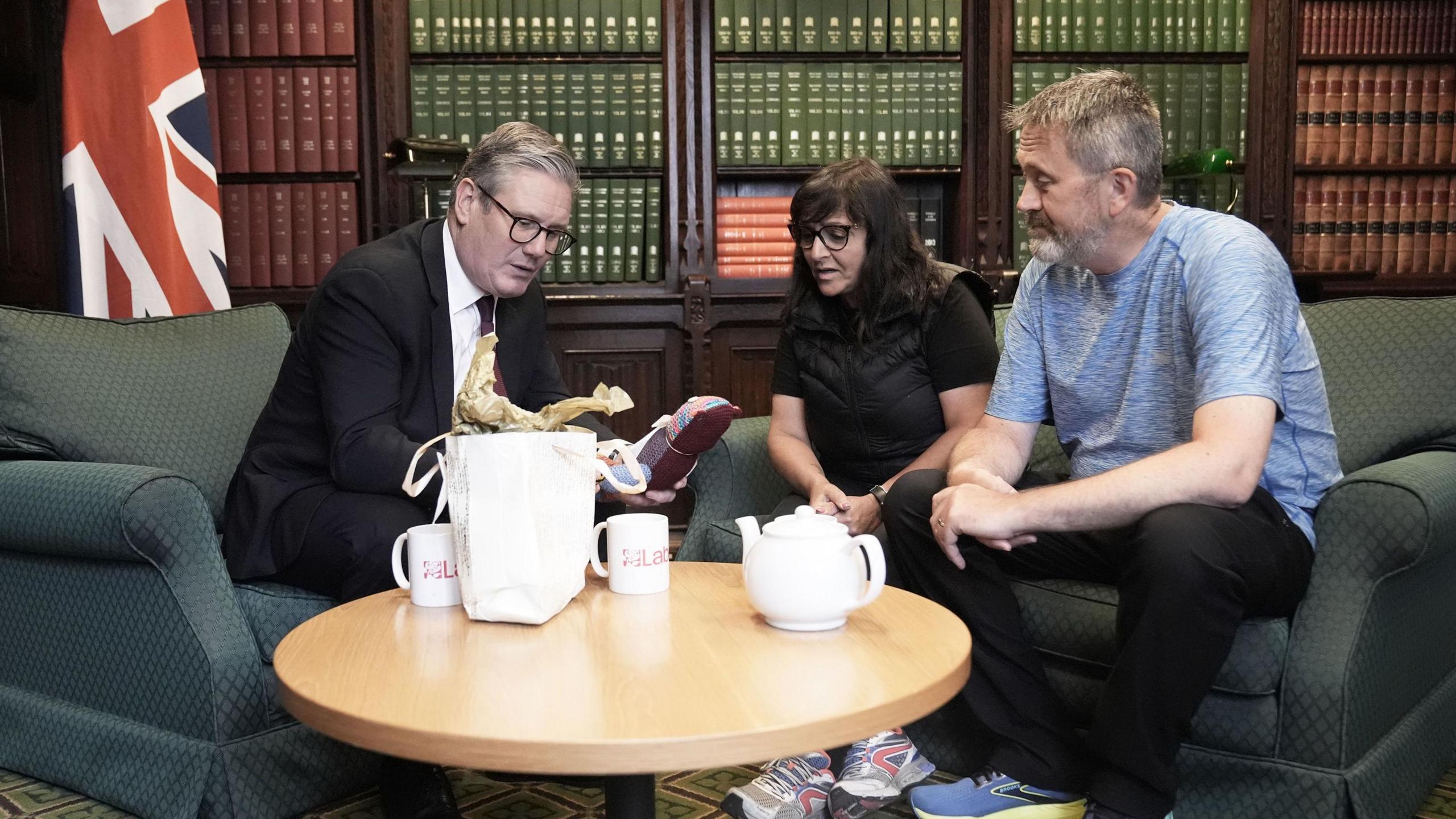 Figen Murray, mother of Manchester Arena bombing victim Martyn Hett, and her husband Stuart speaking to Labour Party leader Sir Keir Starmer (left) about Martyn's Law in the Houses of Parliament in London, after her 200-mile walk to London from the spot where her son was killed in Manchester. 