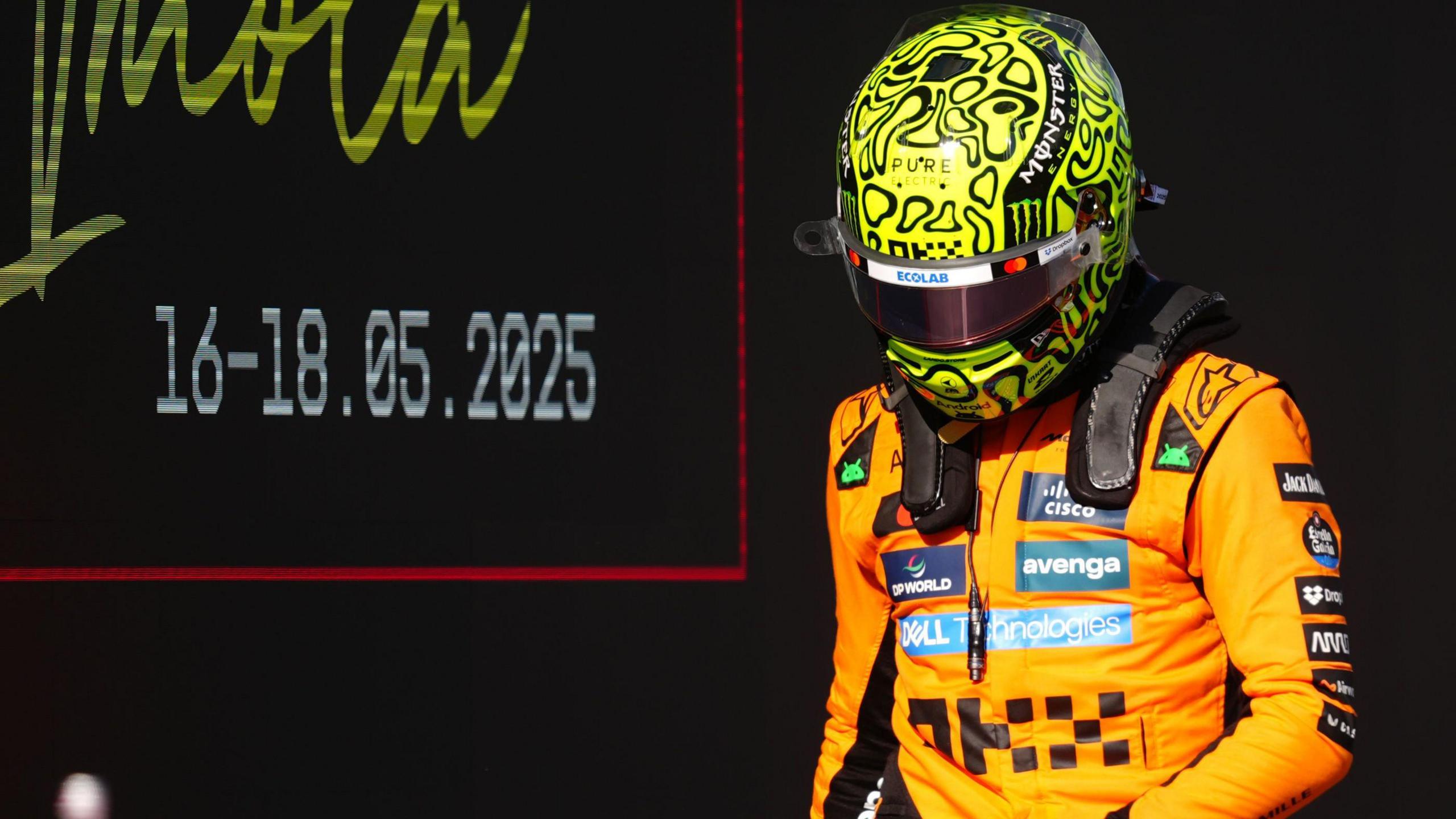 Lando Norris heading back to the McLaren garage after qualifying.