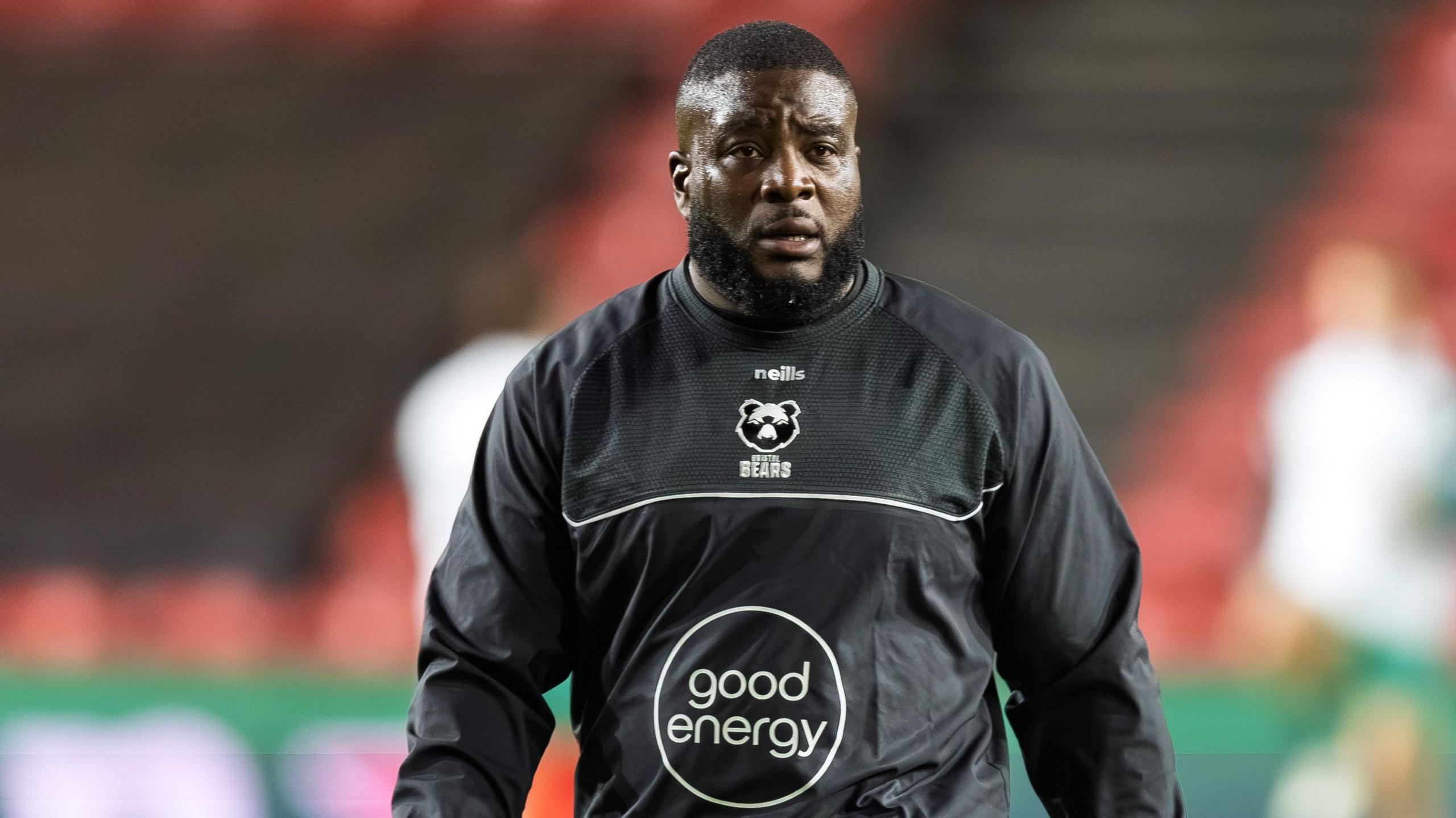 Lovejoy Chawatama walking on the pitch during a pre-game warm-up