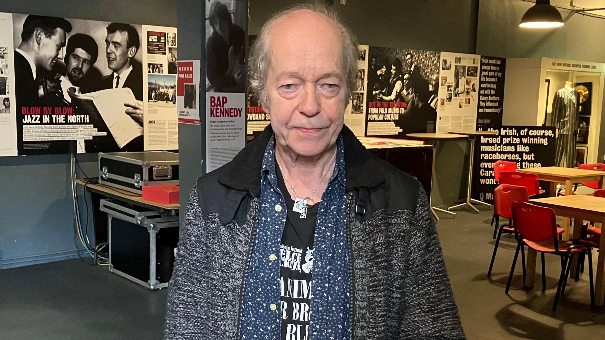 Eric Bell standing in a music exhibition