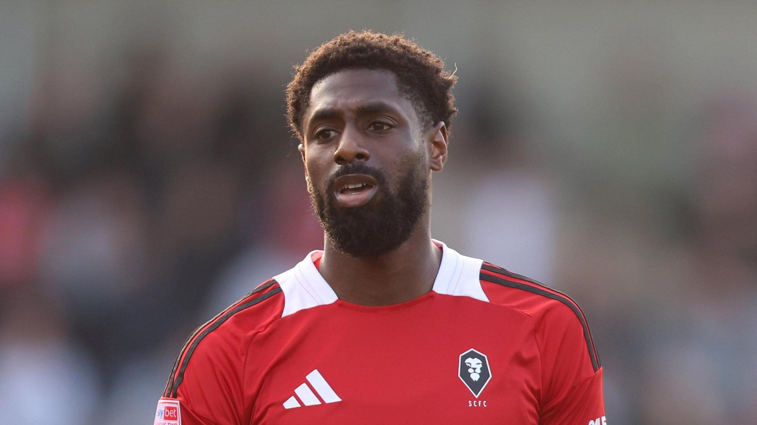 Hakeeb Adelakun playing for Salford at home to Crewe