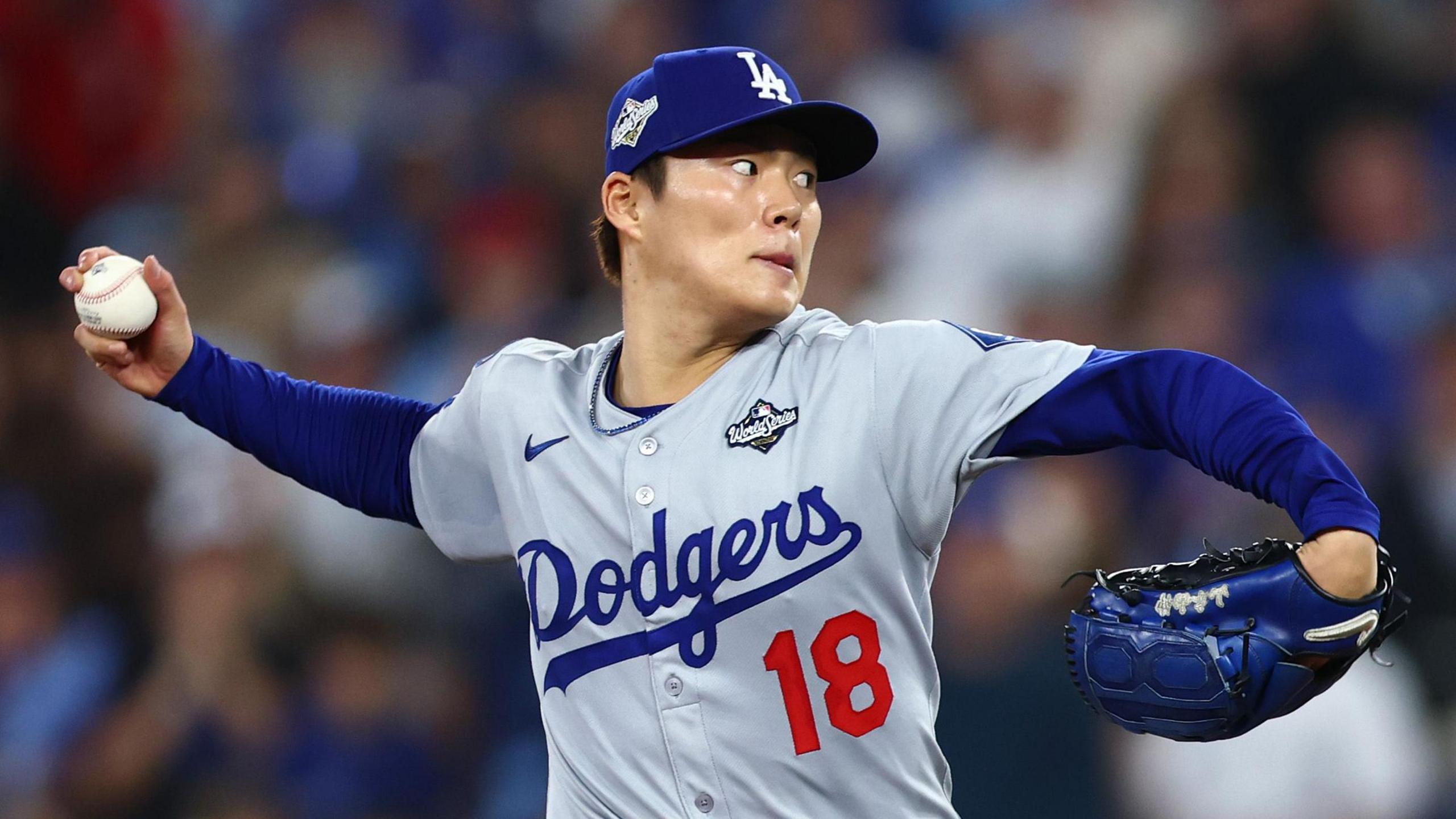 Los Angeles Dodgers pitcher Yoshinobu Yamamoto prepares to deliver a pitch
