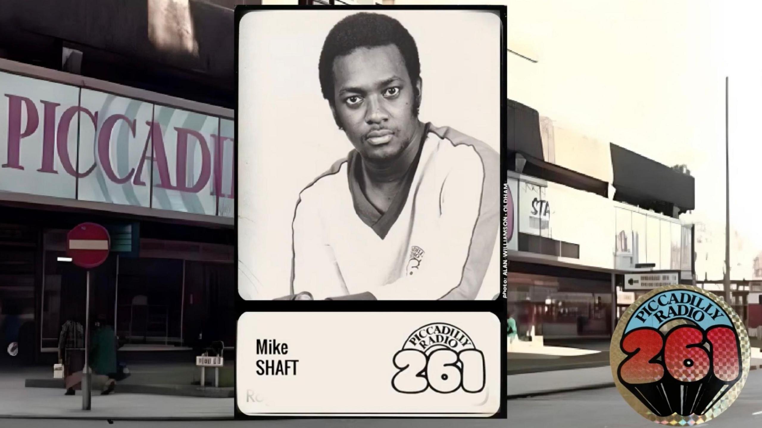 Screenshot of Mike Shaft's presenter card at Piccadilly. He's looking into the camera and is wearing a white v-neck jumper.