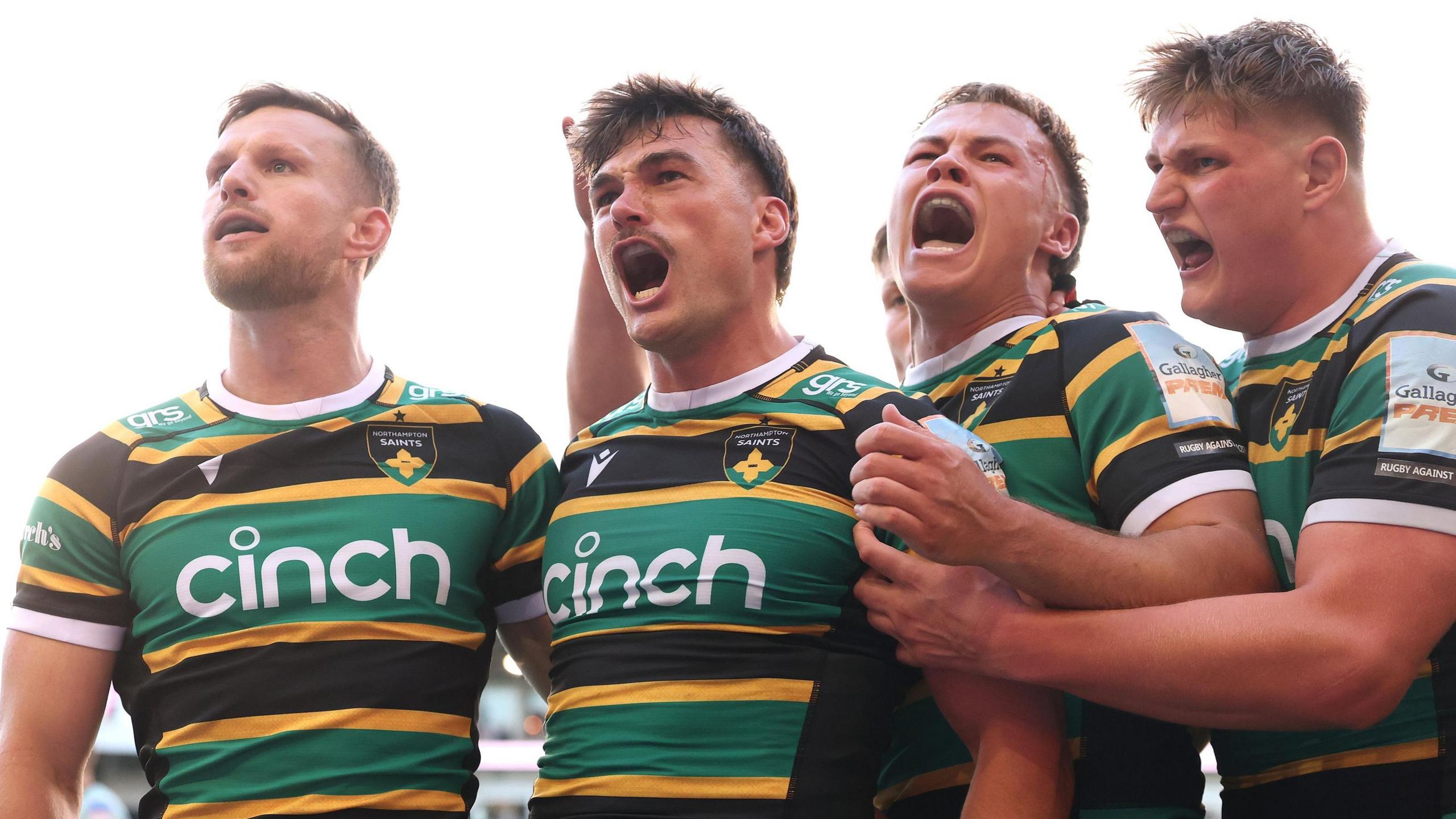 George Furbank (centre) celebrates scoring a try for Northampton against Leicester in the Prem semi-final