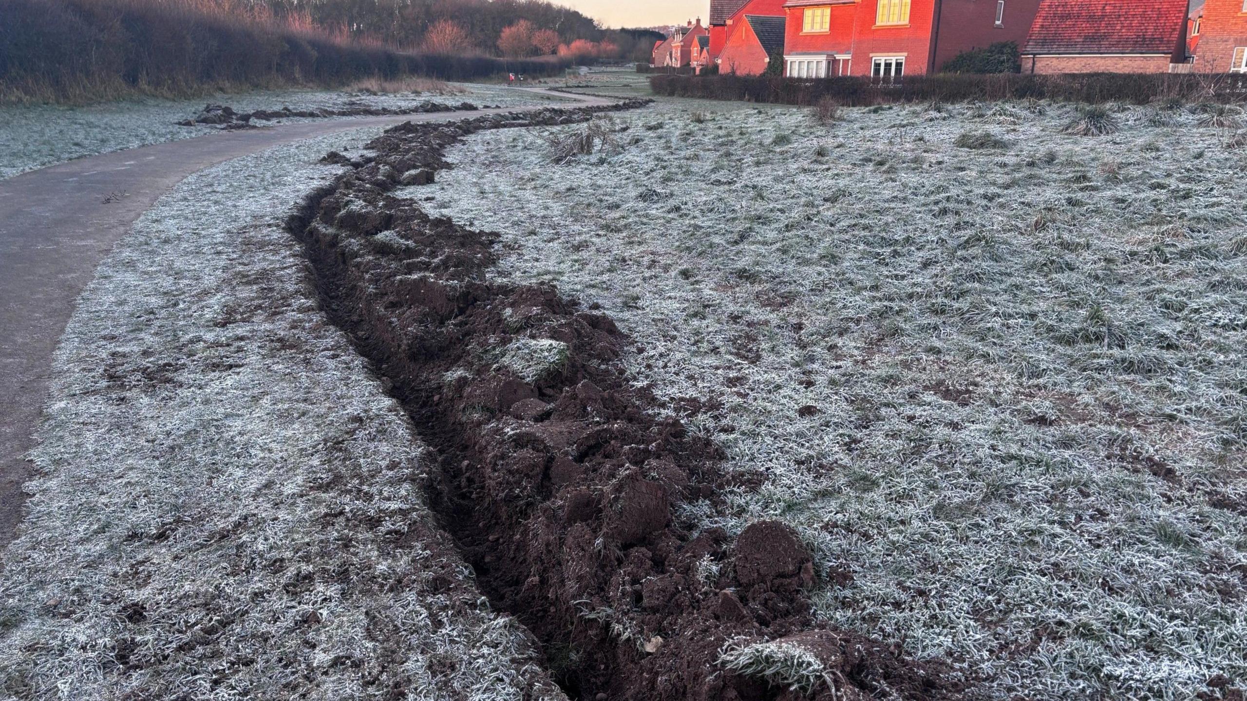 A photograph taken on Thursday after the trenches were dug and successfully kept the water away from the houses. 