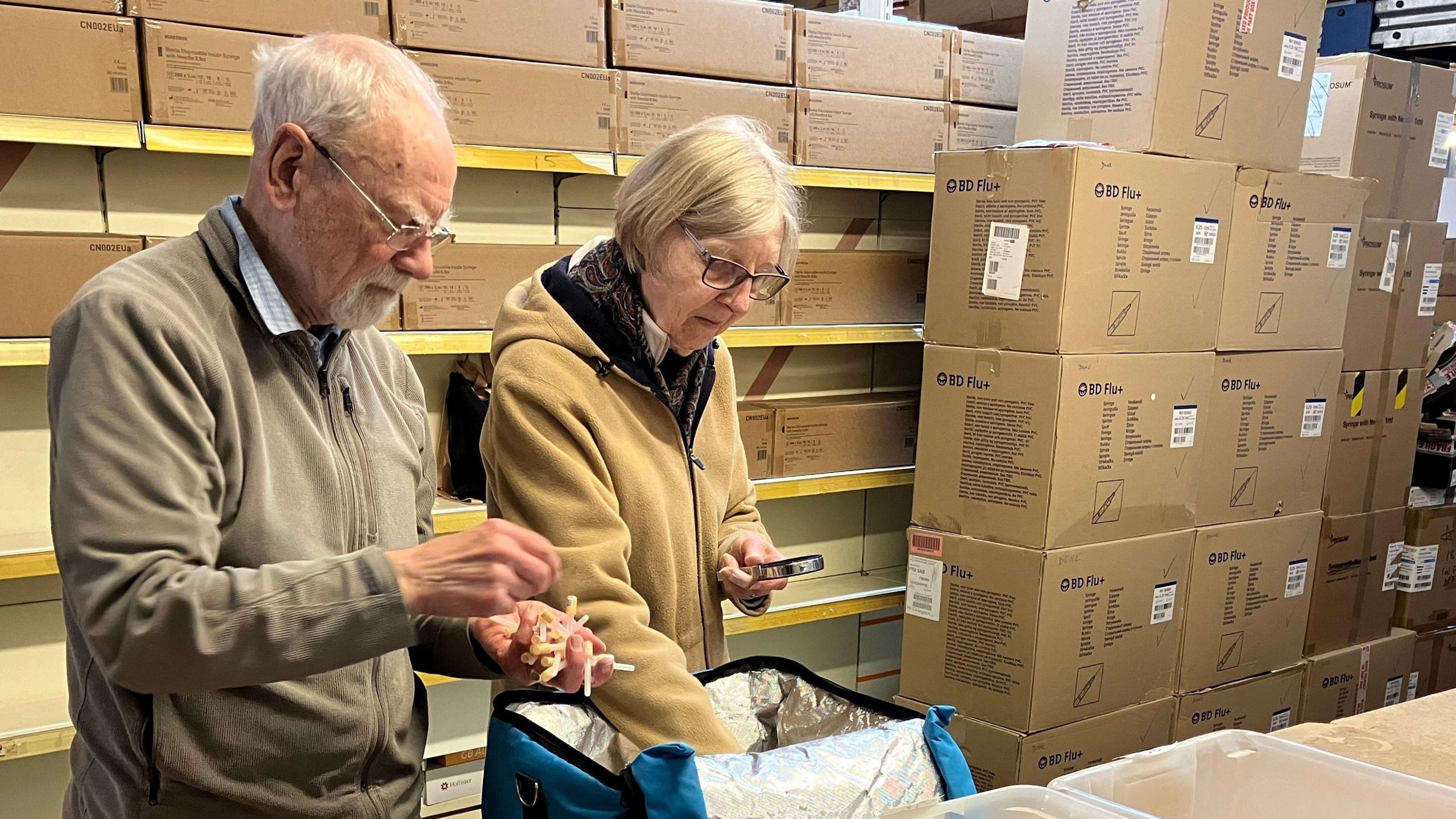 Mike and Diane volunteer sorting medical supplies at Inter Care