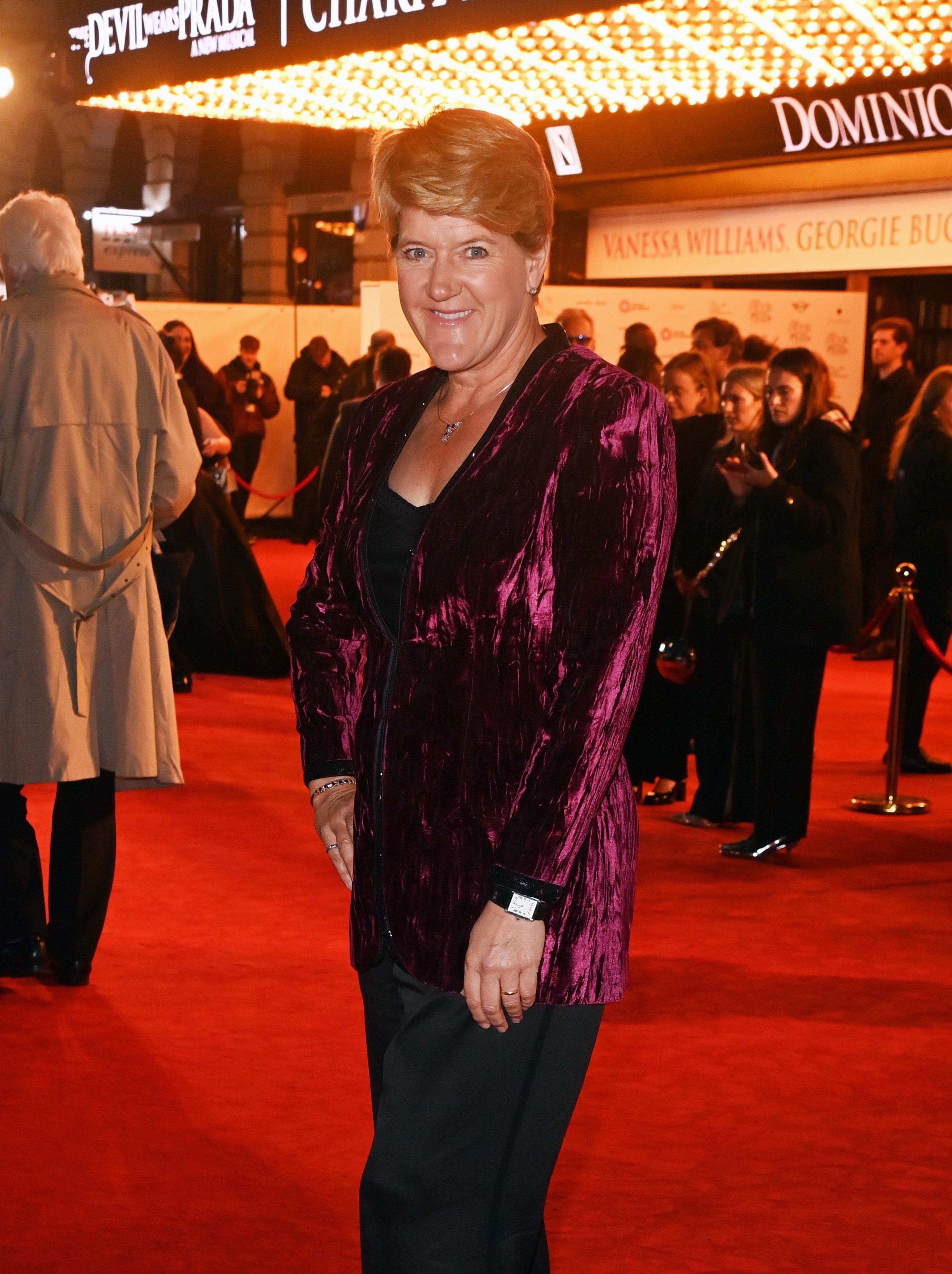 Claire Balding wears purple jacket on red carpet of Devil Wears Prada: The Musical