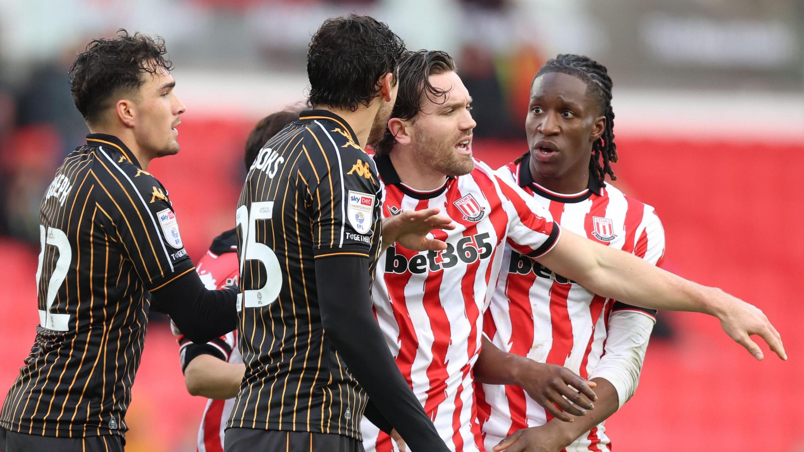 Stoke City and Hull City players clash after the final whistle at the bet365 Stadium
